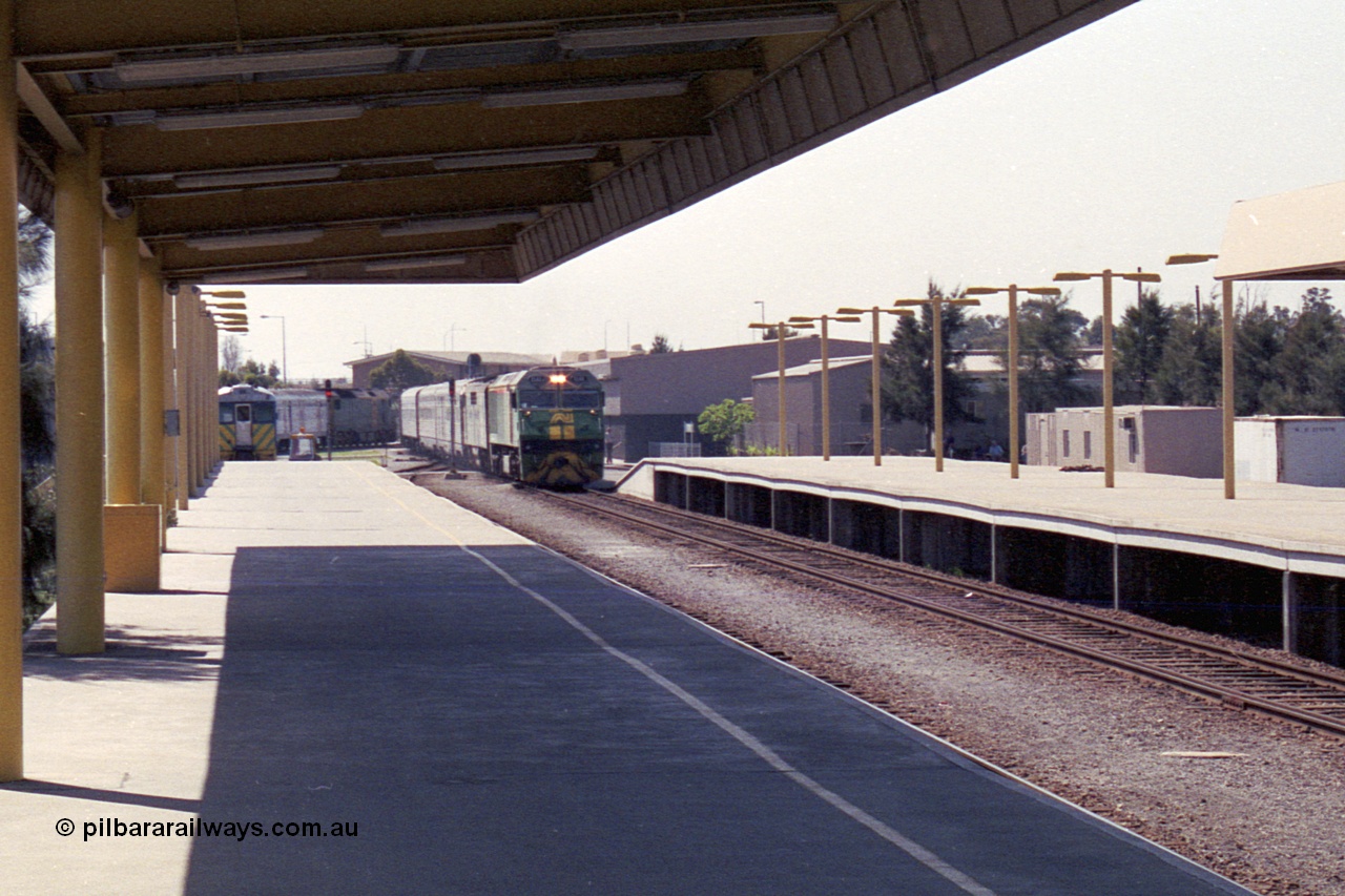 215-28
Keswick, the Australian National Adelaide interstate passenger terminal with the Indian Pacific arriving behind EL class EL 62 Goninan built General Electric CM30-8 serial 8013-07/90-114 with a GM class as second unit.
Keywords: EL-class;EL62;Goninan;GE;CM30-8;8013-07/90-114;