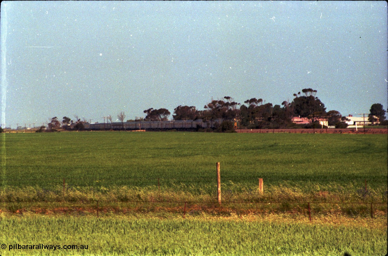 216-00
Long Plains, the down passenger train to Alice Springs 'The Ghan' on approach with power from an AN livered DL class DL 37 Clyde Engineering EMD model AT42C serial 88-1245.
Keywords: DL-class;DL49;Clyde-Engineering-Kelso-NSW;EMD;AT42C;89-1268;