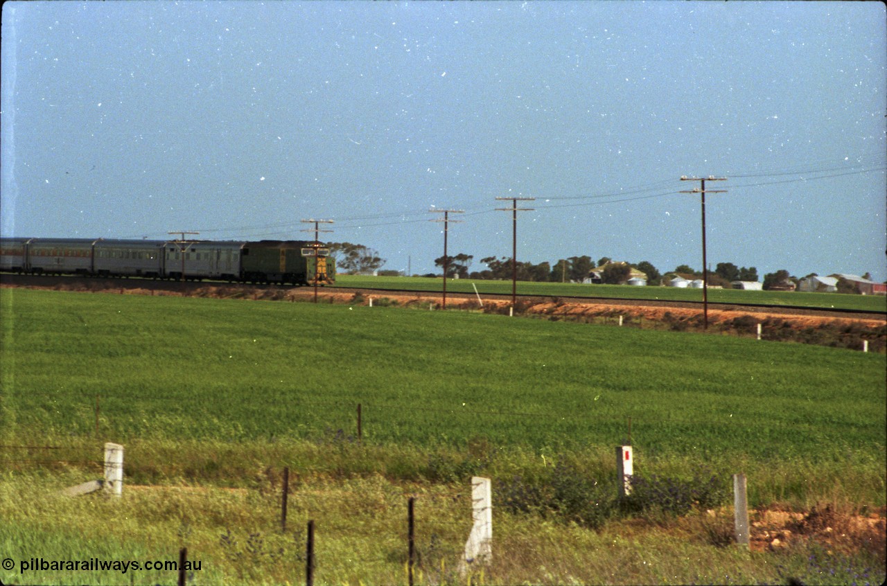 216-01
Long Plains, the down passenger train to Alice Springs 'The Ghan' on approach with power from an AN livered DL class DL 37 Clyde Engineering EMD model AT42C serial 88-1245.
Keywords: DL-class;DL49;Clyde-Engineering-Kelso-NSW;EMD;AT42C;89-1268;