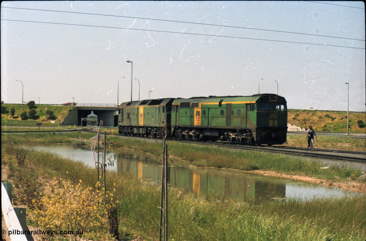 216-13
Dry Creek Motive Power Centre, Australian National standard gauge light engines wearing the AN livery 700 class 705 AE Goodwin ALCo model DL500G serial G6059-3 and BL class leader BL 26 'Bob Hawke' Clyde Engineering EMD model JT26C-2SS serial 83-1010.
Keywords: 700-class;705;AE-Goodwin;ALCo;DL500G;G6059-3;
