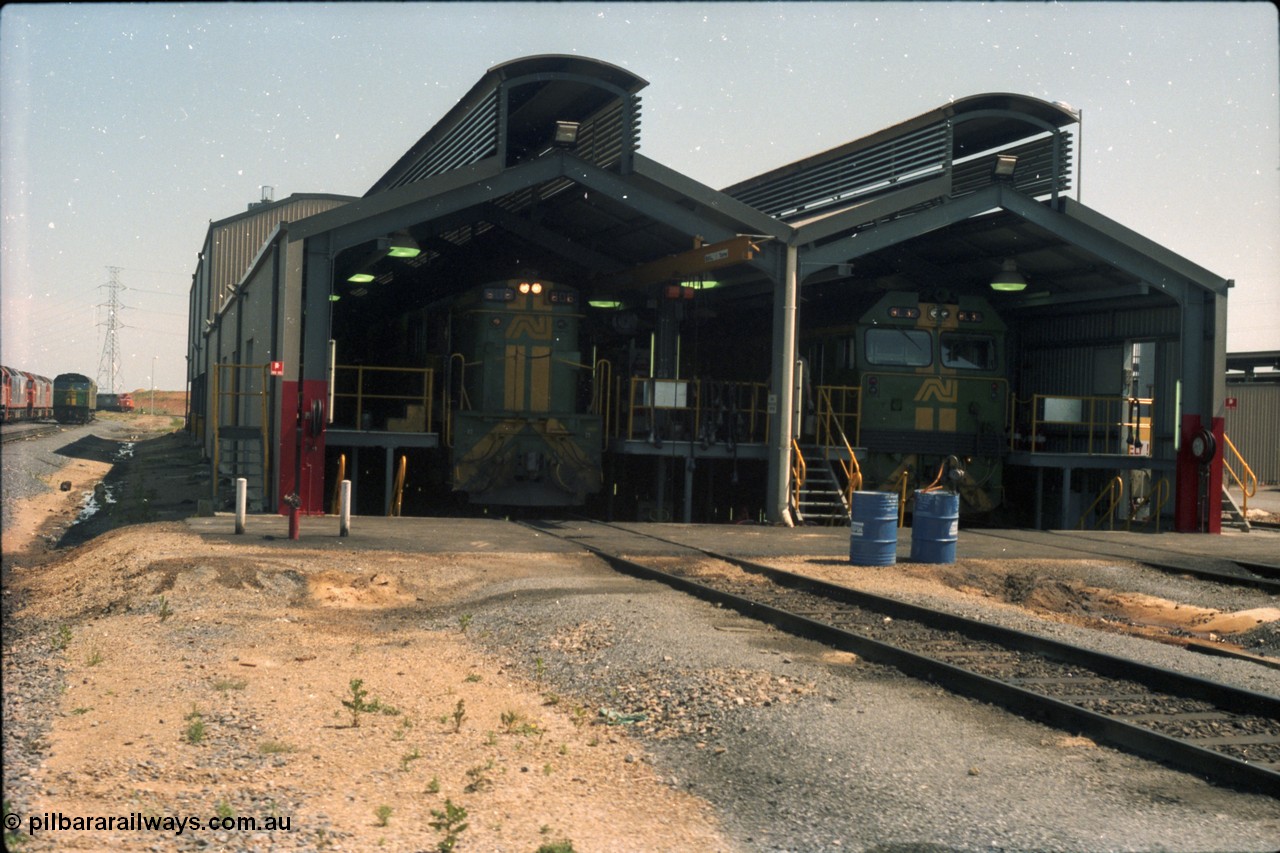 216-18
Dry Creek Motive Power Centre, fuel point shed, standard gauge road on the left with 600 class 606 AE Goodwin ALCo model DL541 serial G6015-5 and dual gauge road on the left with BL class BL 32 Clyde Engineering EMD model JT26C-2SS serial 83-1016.
Keywords: 600-class;606;AE-Goodwin;ALCo;DL541;G6015-5;