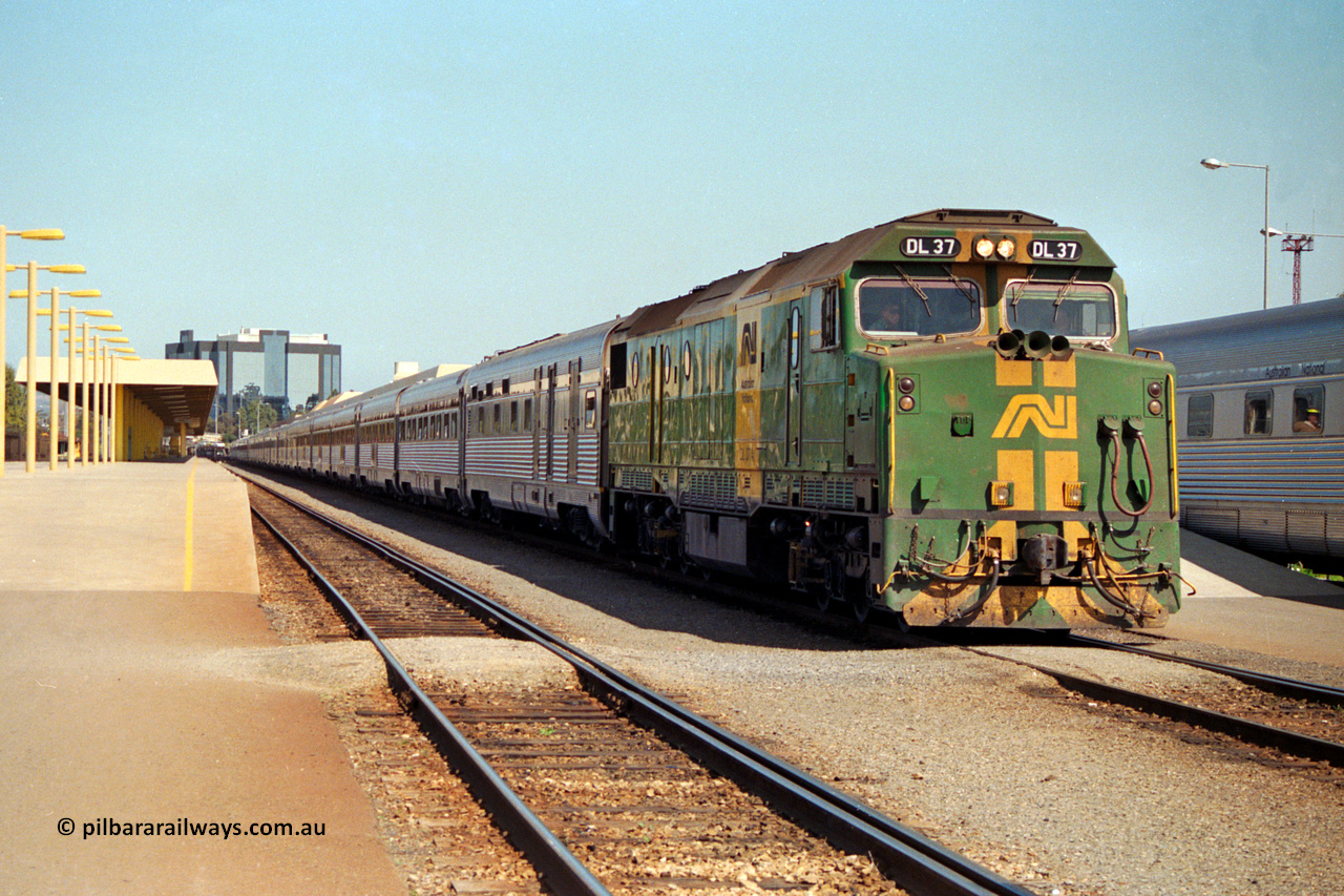 217-05
Keswick Passenger Terminal, Australian National DL class locomotive DL 37 Clyde Engineering EMD model AT42C serial 88-1245 on the pointy end of 'The Ghan' as departure time approaches.
Keywords: DL-class;DL37;Clyde-Engineering-Kelso-NSW;EMD;AT42C;88-1245;