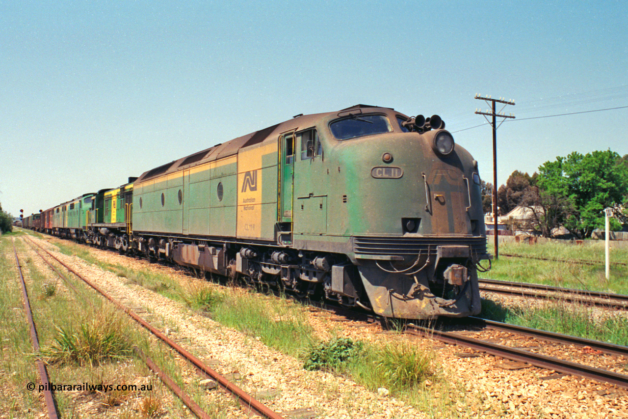 217-10
Peterborough, an SP Perth bound service awaiting line clear behind the AN liveried quad combination of CL class Bulldog CL 11 Clyde Engineering EMD model AT26C serial 71-739, 600 class 605 AE Goodwin ALCo model DL541 serial G6015-4, and GM class Bulldogs GM 43 Clyde Engineering EMD model A16C serial 67-529 and GM 46 serial 67-532.
Keywords: CL-class;CL11;Clyde-Engineering-Granville-NSW;EMD;AT26C;71-739;bulldog;