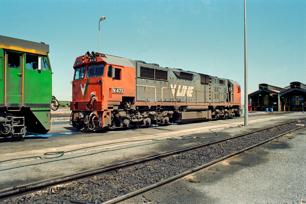 217-25
Dry Creek Motive Power Centre, fuel point roads sees V/Line broad gauge N class locomotive N 473 Clyde Engineering EMD model JT22HC-2 serial 87-1202 resting after running the overnight passenger train 'The Overland' from Melbourne and will return with the Melbourne bound service in the early evening.
Keywords: N-class;N473;Clyde-Engineering-Somerton-Victoria;EMD;JT22HC-2;87-1202;