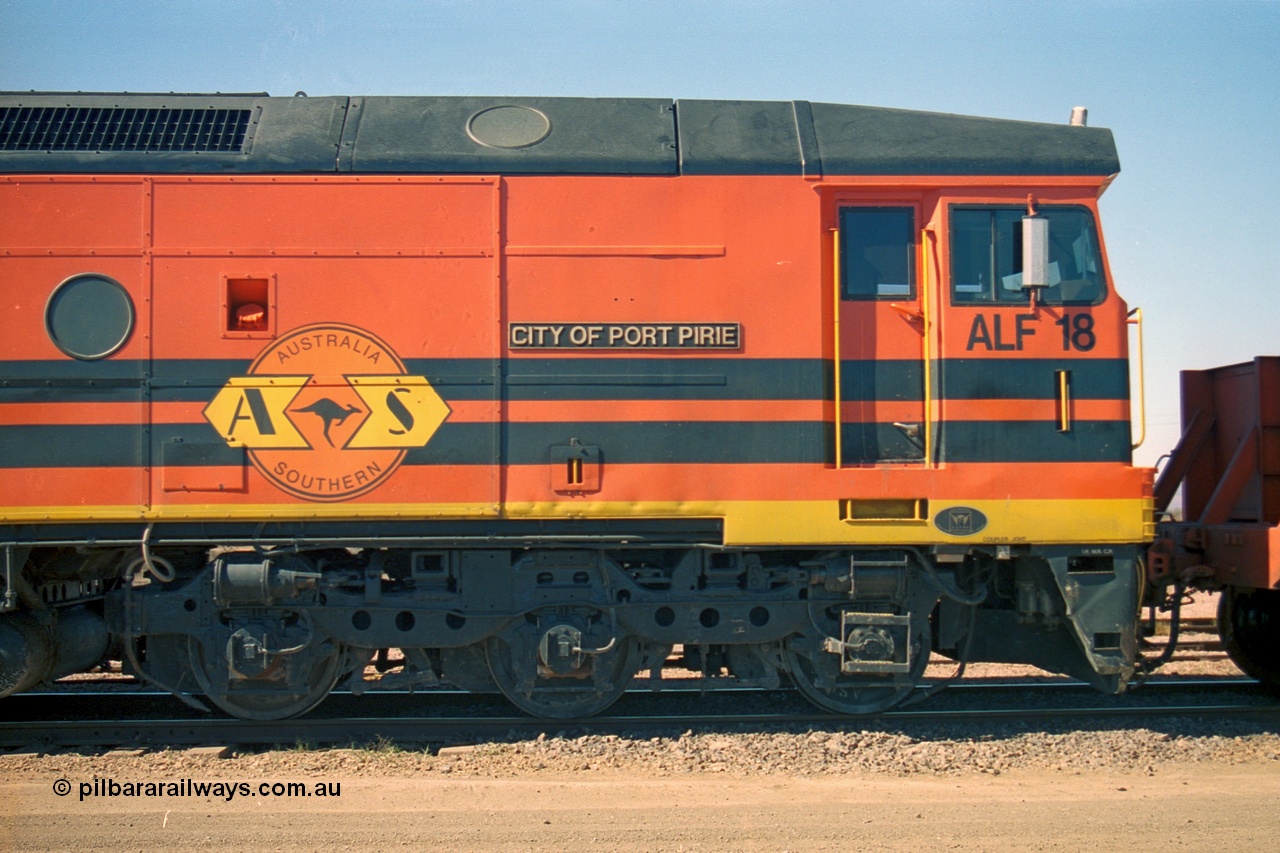 244-10
Port Augusta yard, cab side shot of Morrison Knudsen rebuild unit ALF 18 City of Port Pirie, model JT26C-2M serial 94-AN-018 in Australian Southern livery, originally AL class AL 21.
Keywords: ALF-class;ALF18;MKA;EMD;JT26C-2M;94-AN-018;rebuild;AL-class;AL21;Clyde-Engineering;EMD;JT26C;76-837;