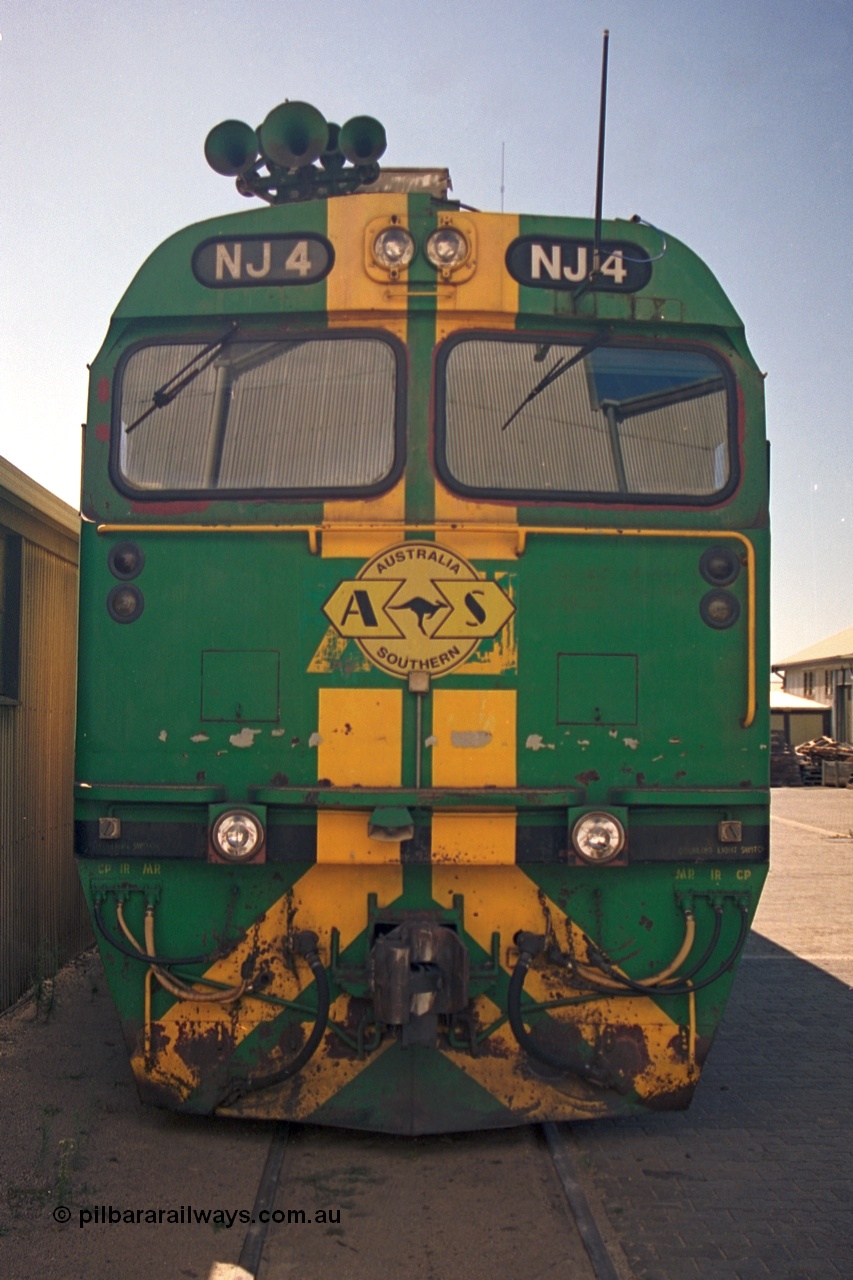 244-27
Port Lincoln loco workshops, still wearing the former owners AN livery, Australian Southern NJ class NJ 4 Clyde Engineering EMD model JL22C serial 71-731, cab front view. 6th April 2003.
Keywords: NJ-class;NJ4;Clyde-Engineering-Granville-NSW;EMD;JL22C;71-731;