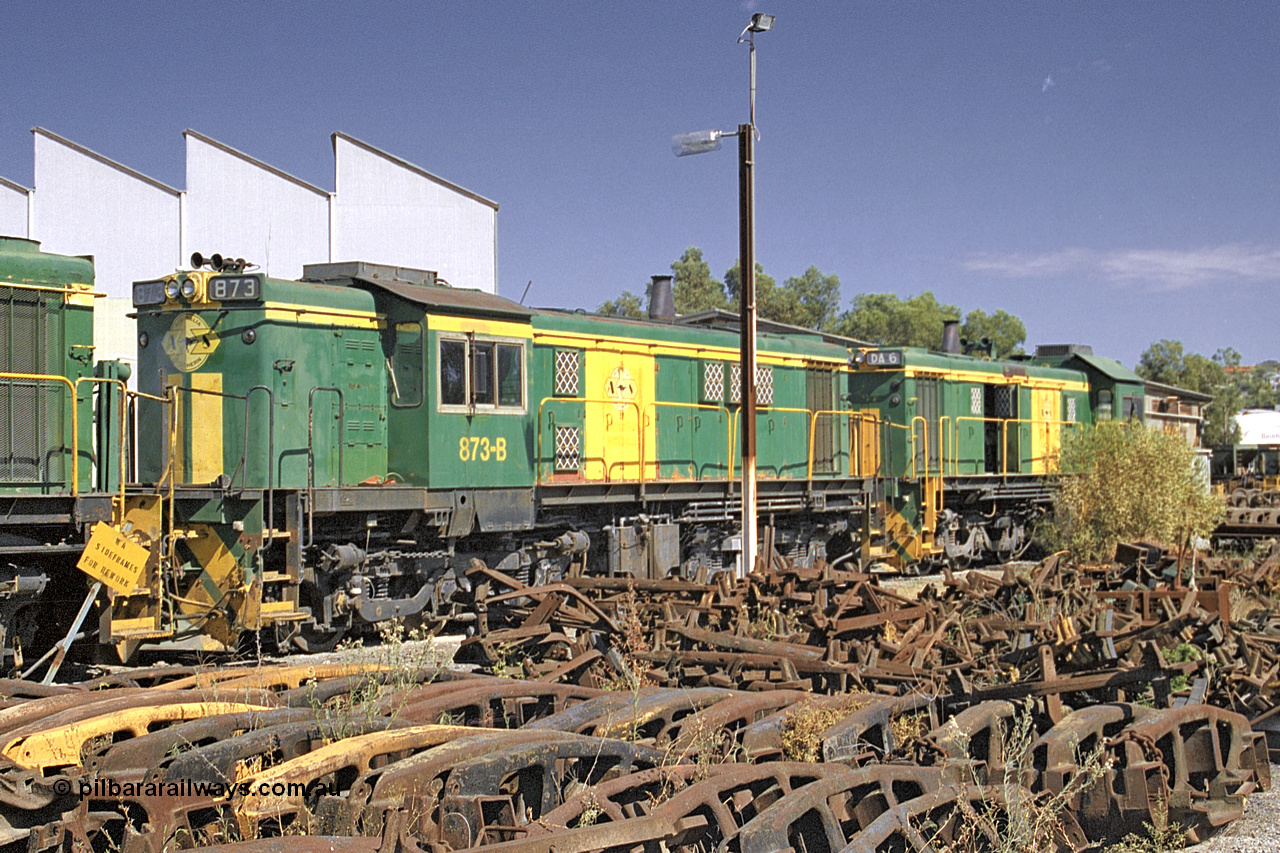 245-03
Port Lincoln loco workshops, still in former owner Australian National livery, Australian Southern narrow gauge 830 class locomotive 873 in an AE Goodwin built ALCo DL531 model with serial G3422-3 built new for the SAR in 1966 and delivered new to Port Lincoln in April 1966, it has spent it's whole working life on the Eyre Peninsula. 6th April 2003.
Keywords: 830-class;873;AE-Goodwin;ALCo;DL531;G3422-3;