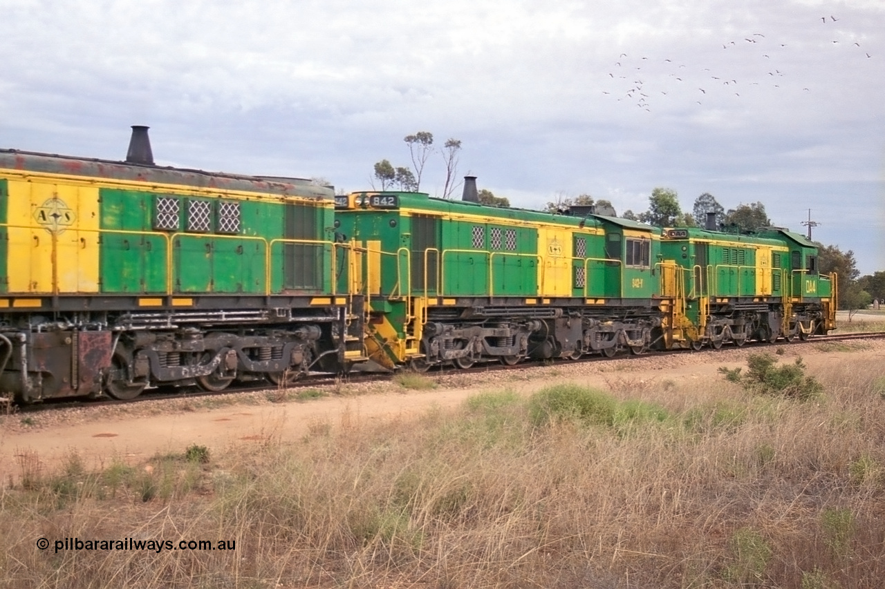 245-14
Wudinna, empty grain train shunts a rake of waggons before backing them into the grain siding, former Australian National Co-Co locomotives AE Goodwin ALCo model DL531 830 class units 842, serial no. 84140 and 851 serial no. 84137, 851 having been on the Eyre Peninsula since delivered in 1962. 7th April, 2003.
Keywords: 830-class;842;AE-Goodwin;ALCo;DL531;84140;
