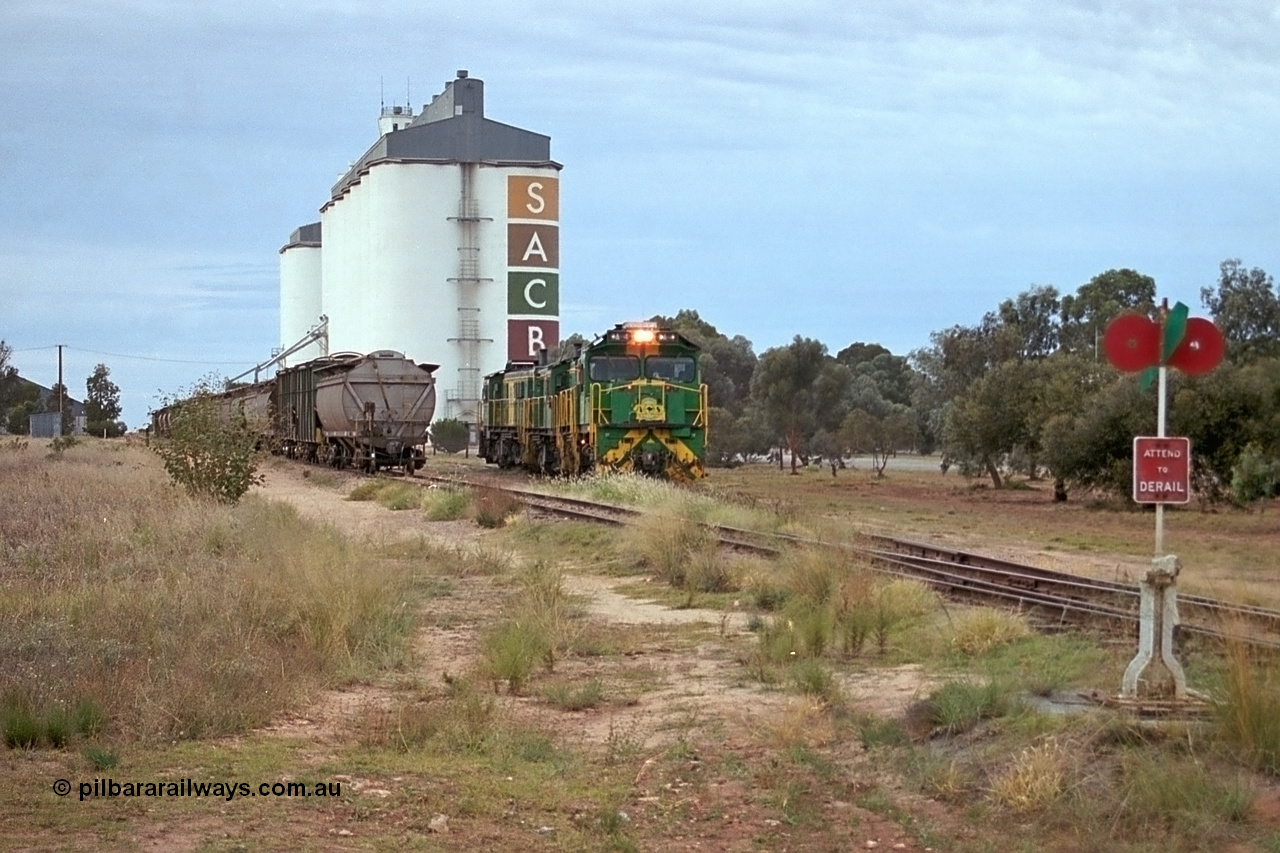 245-19
Wudinna, empty grain train locos shunt back towards the mainline having dropped waggons in the siding, a trio of former Australian National Co-Co locomotives with rebuilt former AE Goodwin ALCo model DL531 830 class ex 839, serial no. 83730, rebuilt by Port Augusta Workshops to DA class, DA 4 leading two AE Goodwin ALCo model DL531 830 class units 842, serial no. 84140 and 851 serial no. 84137, 851 having been on the Eyre Peninsula since delivered in 1962. 7th April, 2003.
Keywords: DA-class;DA4;83730;Port-Augusta-WS;ALCo;DL531G/1;830-class;839;rebuild;