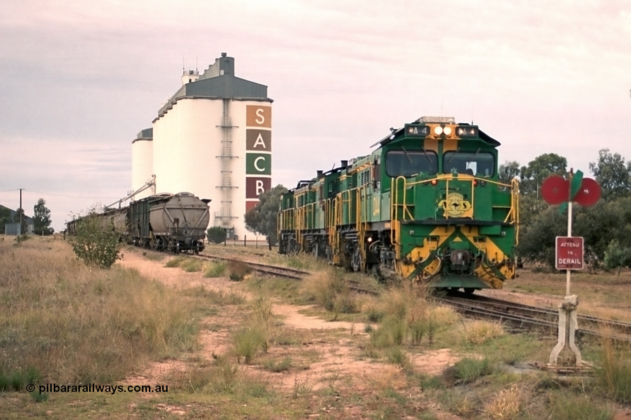 245-20
Wudinna, empty grain train locos shunt back towards the mainline having dropped waggons in the siding, a trio of former Australian National Co-Co locomotives with rebuilt former AE Goodwin ALCo model DL531 830 class ex 839, serial no. 83730, rebuilt by Port Augusta Workshops to DA class, DA 4 leading two AE Goodwin ALCo model DL531 830 class units 842, serial no. 84140 and 851 serial no. 84137, 851 having been on the Eyre Peninsula since delivered in 1962. 7th April, 2003.
Keywords: DA-class;DA4;83730;Port-Augusta-WS;ALCo;DL531G/1;830-class;839;rebuild;