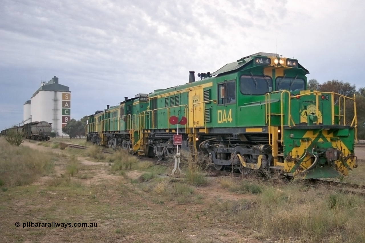 245-21
Wudinna, empty grain train locos shunt back towards the mainline having dropped waggons in the siding, a trio of former Australian National Co-Co locomotives with rebuilt former AE Goodwin ALCo model DL531 830 class ex 839, serial no. 83730, rebuilt by Port Augusta Workshops to DA class, DA 4 leading two AE Goodwin ALCo model DL531 830 class units 842, serial no. 84140 and 851 serial no. 84137, 851 having been on the Eyre Peninsula since delivered in 1962. 7th April, 2003.
Keywords: DA-class;DA4;83730;Port-Augusta-WS;ALCo;DL531G/1;830-class;839;rebuild;