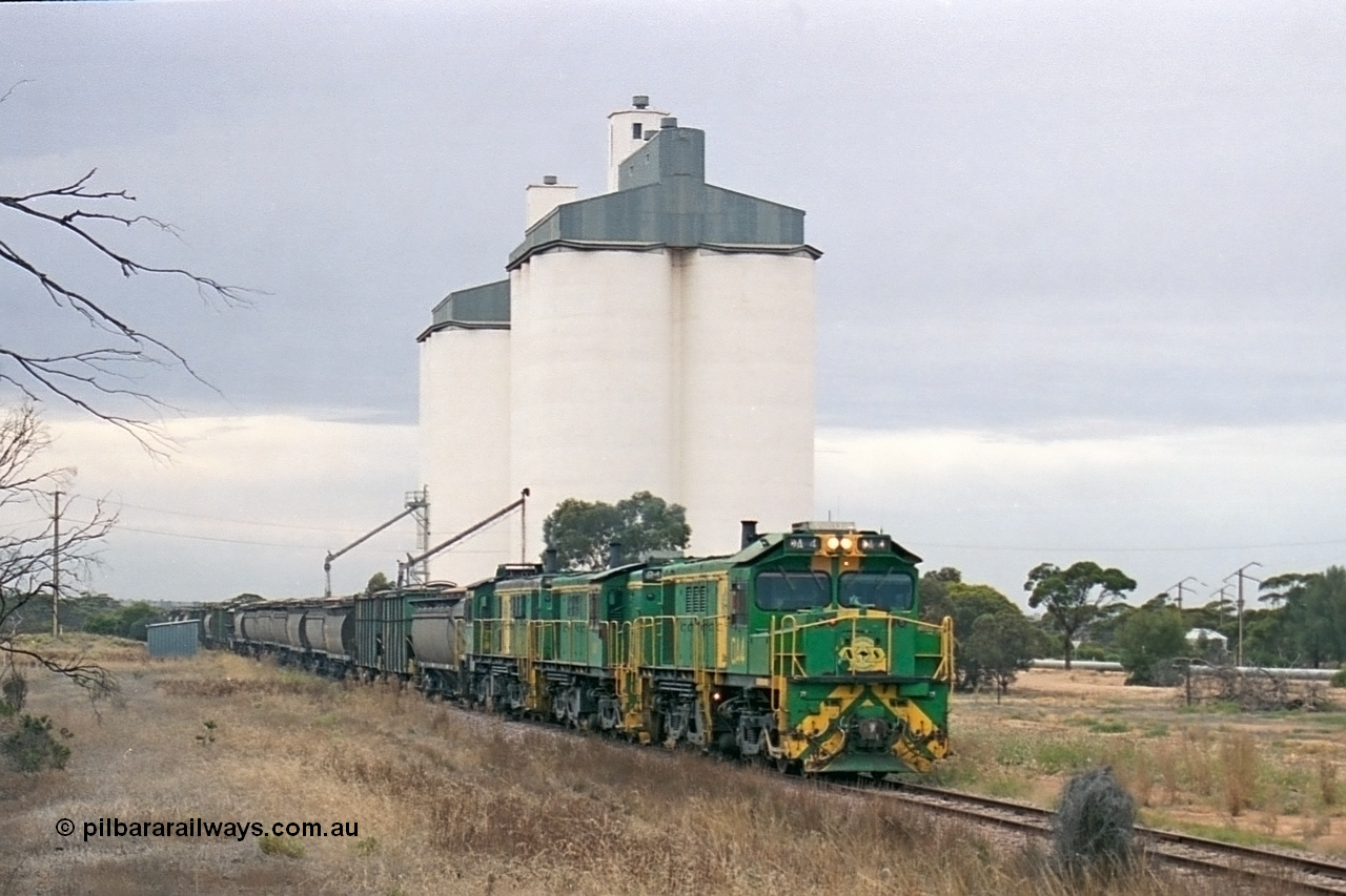 245-27
Yaninee, empty grain train behind a trio of former Australian National Co-Co locomotives with rebuilt former AE Goodwin ALCo model DL531 830 class ex 839, serial no. 83730, rebuilt by Port Augusta Workshops to DA class, leading two AE Goodwin ALCo model DL531 830 class units 842, serial no. 84140 and 851 serial no. 84137, 851 having been on the Eyre Peninsula since delivered in 1962, runs through express on the mainline. 7th April, 2003.
Keywords: DA-class;DA4;83730;Port-Augusta-WS;ALCo;DL531G/1;830-class;839;rebuild;