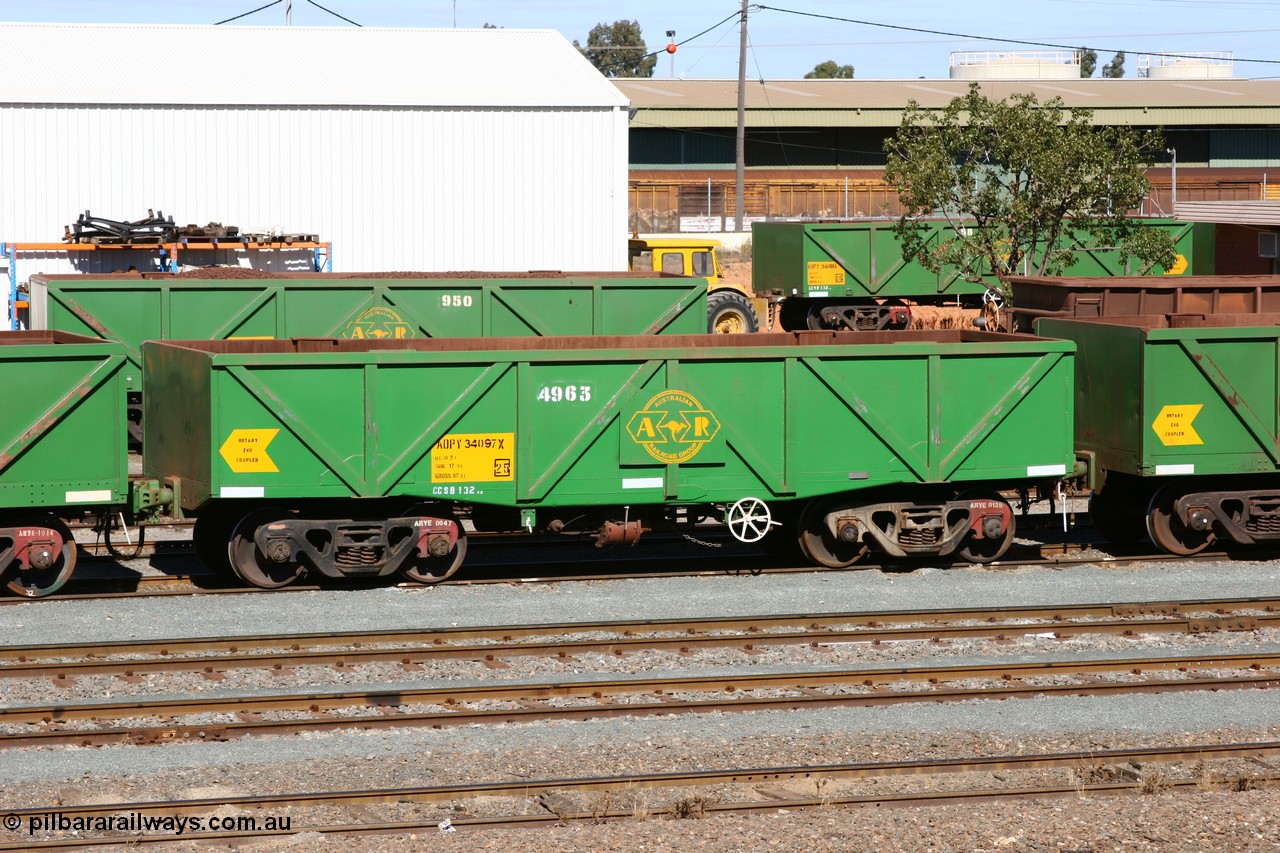 060528 4433
West Kalgoorlie, AOPY 34097, fleet number 4963, the 4 is a recent addition, is a drop floor version of one of seventy ex ANR coal waggons rebuilt from AOKF type by Bluebird Engineering SA in service with ARG on Koolyanobbing iron ore trains. They used to be three metres longer and originally built by Metropolitan Cammell Britain as GB type in 1952-55, 28th May 2006.
Keywords: AOPY-type;AOPY34097;Bluebird-Engineering-SA;Metropolitan-Cammell-Britain;GB-type;