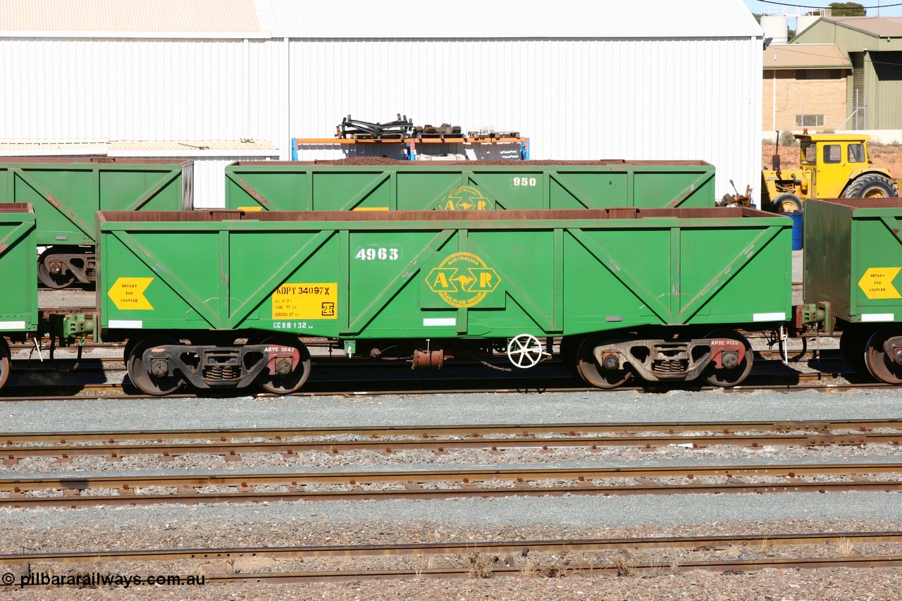 060528 4434
West Kalgoorlie, AOPY 34097, fleet number 4963, the 4 is a recent addition, is a drop floor version, one of seventy ex ANR coal waggons rebuilt from AOKF type by Bluebird Engineering SA in service with ARG on Koolyanobbing iron ore trains. They used to be three metres longer and originally built by Metropolitan Cammell Britain as GB type in 1952-55, 28th May 2006.
Keywords: AOPY-type;AOPY34097;Bluebird-Engineering-SA;Metropolitan-Cammell-Britain;GB-type;