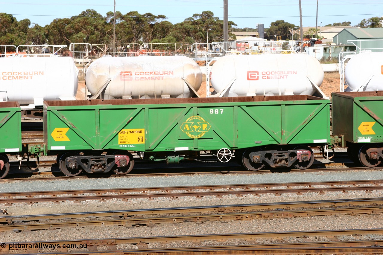 060528 4494
West Kalgoorlie, AOPY 34099, fleet number 967 and of the drop floor type, one of seventy ex ANR coal waggons rebuilt from AOKF type by Bluebird Engineering SA in service with ARG on Koolyanobbing iron ore trains. They used to be three metres longer and originally built by Metropolitan Cammell Britain as GB type in 1952-55, 28th May 2006.
Keywords: AOPY-type;AOPY34099;Bluebird-Engineering-SA;Metropolitan-Cammell-Britain;GB-type;