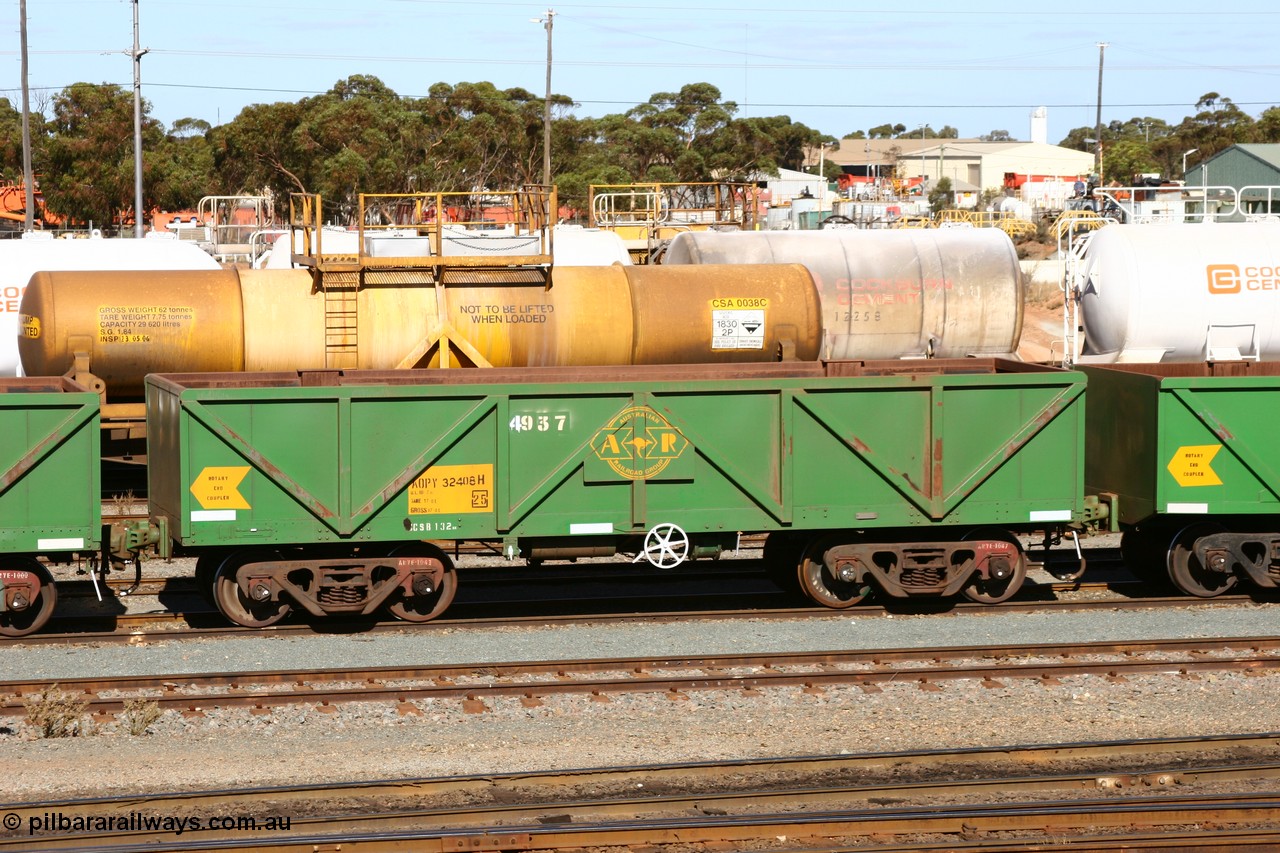 060528 4498
West Kalgoorlie, AOPY 32408, fleet number 4937, the 4 being a recent addition, is one of 70 ex ANR coal waggons rebuilt from AOKF and AOJFs by Bluebird Engineering, SA. Now in service with ARG on Koolyanobbing iron ore trains. They used to be longer by two panels. Prior they were GH's. West Kalgoorlie, 28th May 2006.
Keywords: AOPY-type;AOPY32408;Bluebird-Engineering-SA;Metropolitan-Cammell-Britain;GB-type;