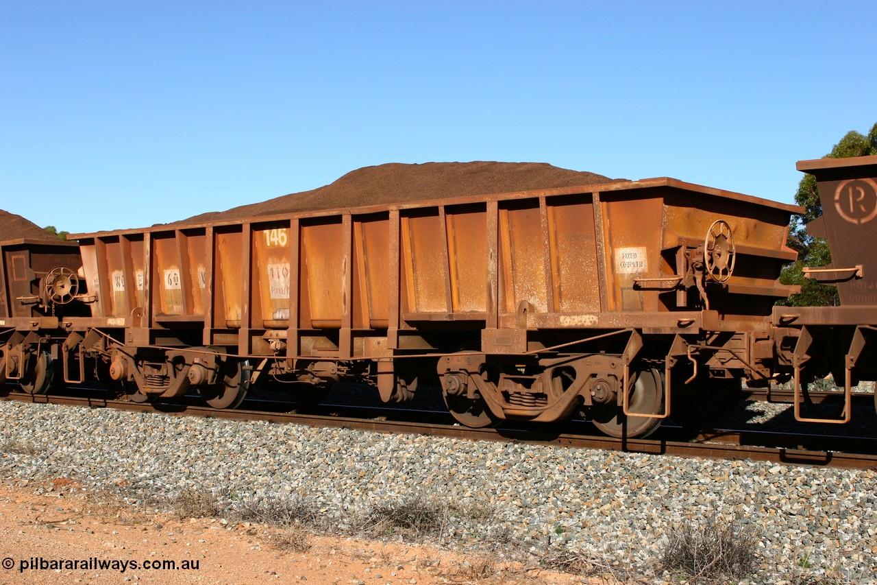 060528 4575
WO type iron ore waggon WO 31260 is one of a batch of sixty two built by Goninan WA between April and August 2000 with serial number 950086-010 and fleet number 146 for Koolyanobbing iron ore operations, and is a Goninan built replacement WO type waggon that replaces the original WAGR built WO type waggon with the newer style WOD type and has square features opposed to the curved ones as on the original WO class, seen here loaded with fines ore on train 413 at Bonnie Vale, 28th May 2006.
Keywords: WO-type;WO31260;Goninan-WA;950086-010;