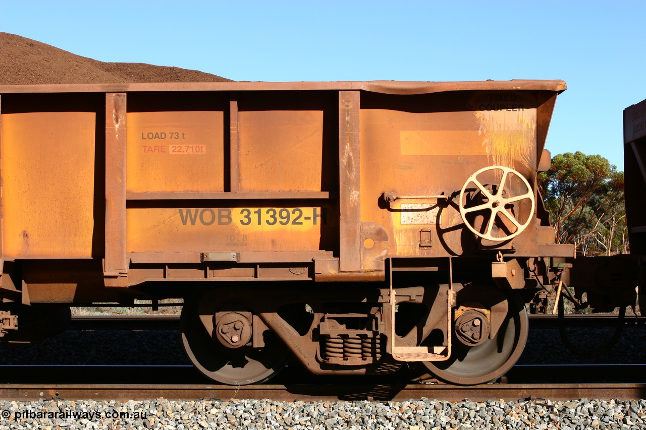 060528 4585
WOB type iron ore waggon WOB 31392 is one of a batch of twenty five built by Comeng WA between 1974 and 1975 and converted from Mt Newman high sided waggons by WAGR Midland Workshops with fleet number 317 for Koolyanobbing iron ore operations, shows the higher tare of these waggons and the capacity of 73 tons, waggon length of 10.8 metres, and a close inspection reveals that the round WAGR waggon builder's number is 31391 of 1974, this waggon cut down originally from a Comeng built Mt Newman Mining ore waggon in 1974. It was then converted to a WSM ballast hopper, then converted back to a WOB by WAGR Midland Workshops. It was originally numbered 31391 by WAGR, seen here loaded with fines at Bonnie Vale, 28th May 2006.
Keywords: WOB-type;WOB31392;Comeng-WA;WSM-type;Mt-Newman-Mining;