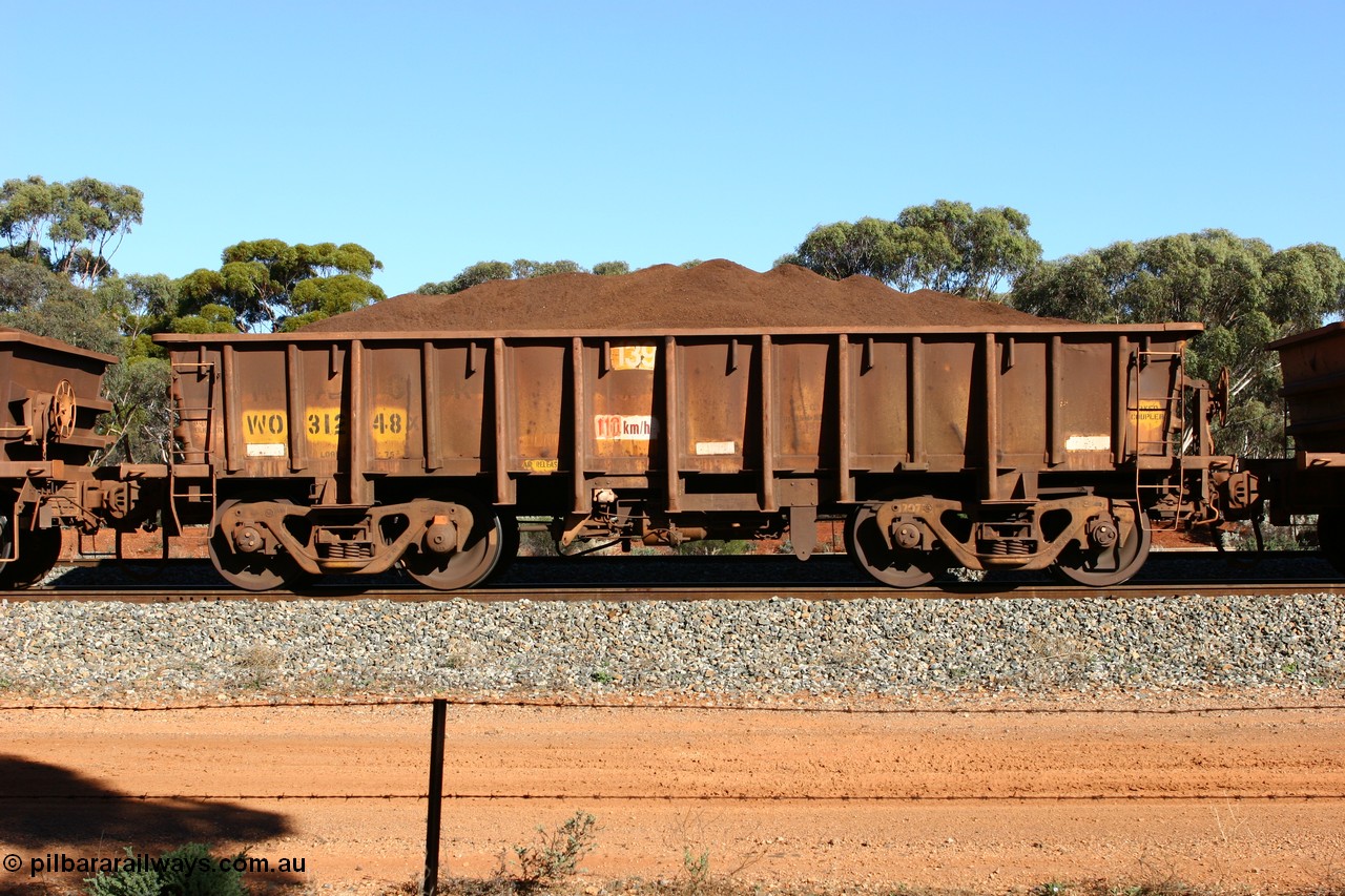 060528 4594
WO type iron ore waggon WO 31248 is one of a batch of eighty six built by WAGR Midland Workshops between 1967 and March 1968 with fleet number 139 for Koolyanobbing iron ore operations, with a 75 ton and 1018 ft³ capacity, loaded with fines seen here at Bonnie Vale, 28th May 2006. This unit was converted to WOG for gypsum in late 1980s till 1990 then reclassed to WOS for superphosphate before being re-classed back to WO in 1994.
Keywords: WO-type;WO31248;WAGR-Midland-WS;