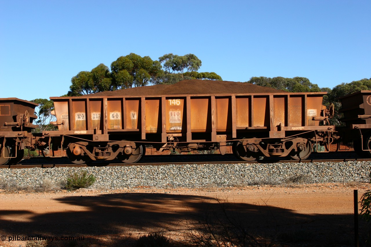060528 4596
WO type iron ore waggon WO 31260 is one of a batch of sixty two built by Goninan WA between April and August 2000 with serial number 950086-010 and fleet number 146 for Koolyanobbing iron ore operations, and is a Goninan built replacement WO type waggon that replaces the original WAGR built WO type waggon with the newer style WOD type and has square features opposed to the curved ones as on the original WO class, seen here loaded with fines ore on train 413 at Bonnie Vale, 28th May 2006.
Keywords: WO-type;WO31260;Goninan-WA;950086-010;