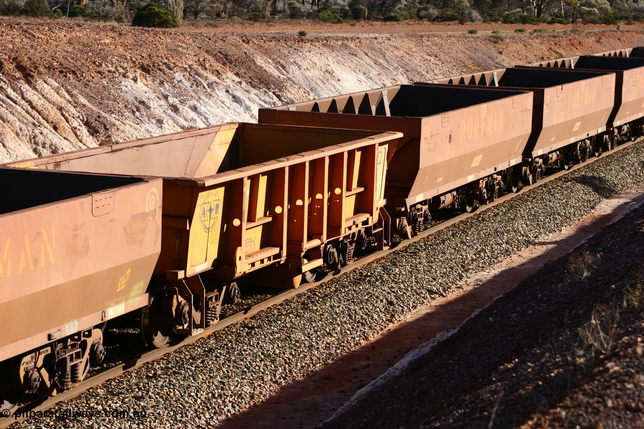 060528 4615
WOB type iron ore waggon WOB 31395 is one of a batch of twenty five built by Comeng WA between 1974 and 1975 and converted from Mt Newman high sided waggons by WAGR Midland Workshops with a capacity of 67 tons with fleet number 325 for Koolyanobbing iron ore operations. This waggon was also converted to a WSM type ballast hopper by re-fitting the cut down top section and having bottom discharge doors fitted, converted back to WOB in 1997, and this is the first one to be repainted in ARG yellow and stands out against the newer style WOE type waggons as this empty train runs past the 628 km west of Bonnie Vale, 28th May 2006.
Keywords: WOB-type;WOB31395;Comeng-WA;WSM-type;Mt-Newman-Mining;