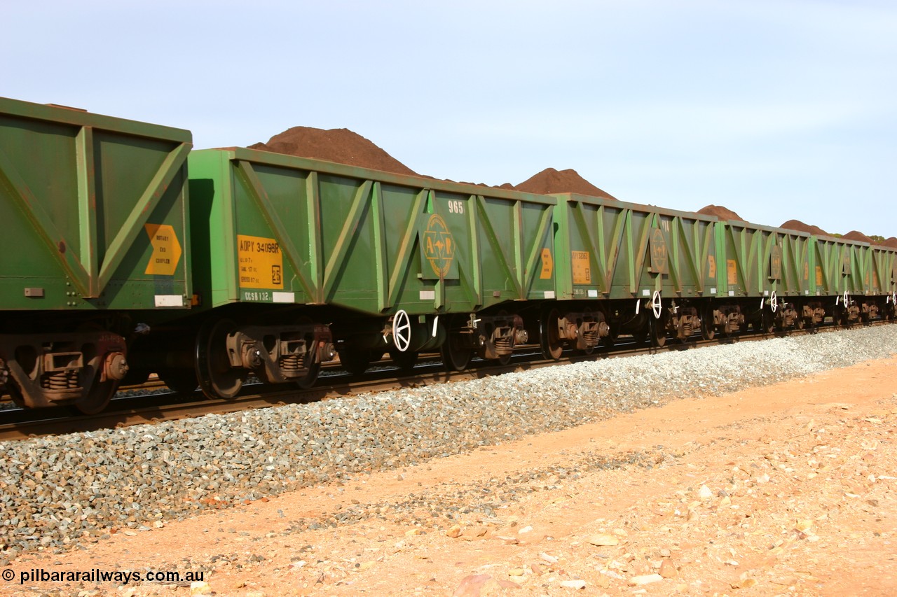 060531 5005
Binduli, AOPY 34098, fleet number 965 of the drop floor type, one of seventy ex ANR coal waggons rebuilt from AOKF type by Bluebird Engineering SA in service with ARG on Koolyanobbing iron ore trains. They used to be three metres longer and originally built by Metropolitan Cammell Britain as GB type in 1952-55, seen here in the consist with sister waggons of a loaded train bound for West Kalgoorlie, 31st May 2006.
Keywords: AOPY-type;AOPY34098;Bluebird-Engineering-SA;Metropolitan-Cammell-Britain;GB-type;
