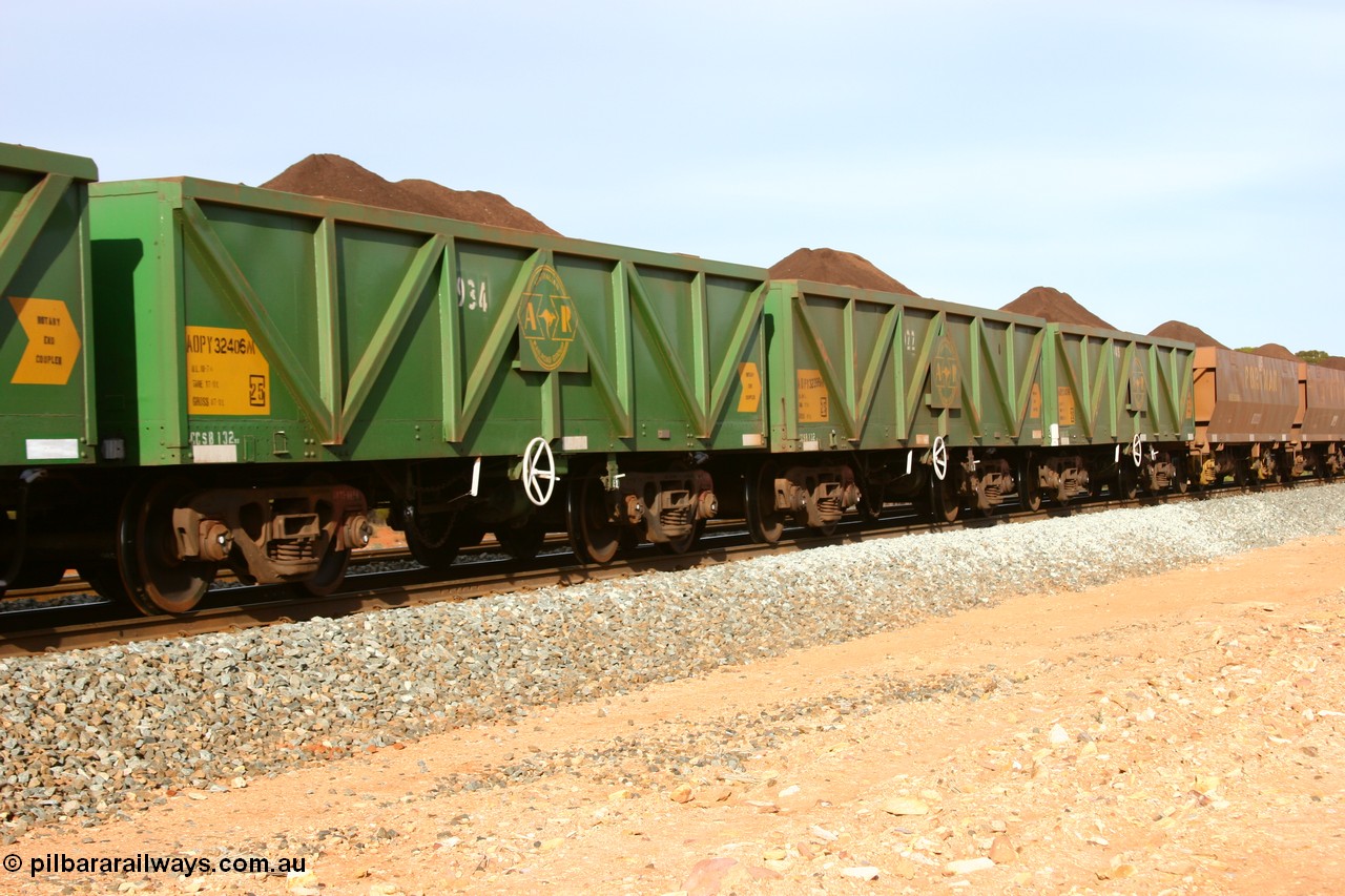 060531 5007
Binduli, AOPY 32406, fleet number 934, one of seventy ex ANR coal waggons rebuilt from AOKF type by Bluebird Engineering SA in service with ARG on Koolyanobbing iron ore trains. They used to be three metres longer and originally built by Metropolitan Cammell Britain as GB type in 1952-55, seen here in the consist with sister waggons of a loaded train bound for West Kalgoorlie, 31st May 2006.
Keywords: AOPY-type;AOPY32406;Bluebird-Engineering-SA;Metropolitan-Cammell-Britain;GB-type;