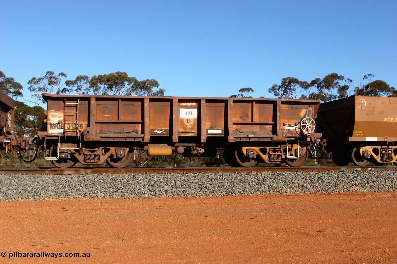 070531 9729
WOB type iron ore waggon WOB 31376 is leader of a batch of twenty five built by Comeng WA between 1974 and 1975 and converted from Mt Newman high sided waggons by WAGR Midland Workshops with a capacity of 67 tons with fleet number 301 for Koolyanobbing iron ore operations. In an empty train at Binduli, 31st May 2007.
Keywords: WOB-type;WOB31376;Comeng-WA;Mt-Newman-Mining;