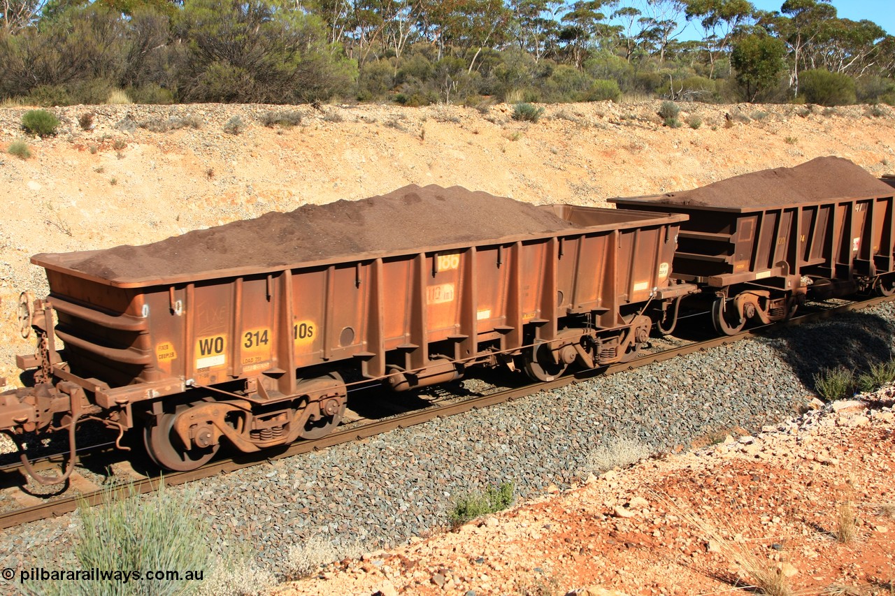 100602 8539
WO type iron ore waggon WO 31410 is one of a batch of eleven replacement waggons built by WAGR Midland Workshops between 1970 and 1971 with fleet number 186 for Koolyanobbing iron ore operations, with a 75 ton and 1018 ft³ capacity, loaded with fines just west of Binduli, 2nd June 2010.
Keywords: WO-type;WO31410;WAGR-Midland-WS;