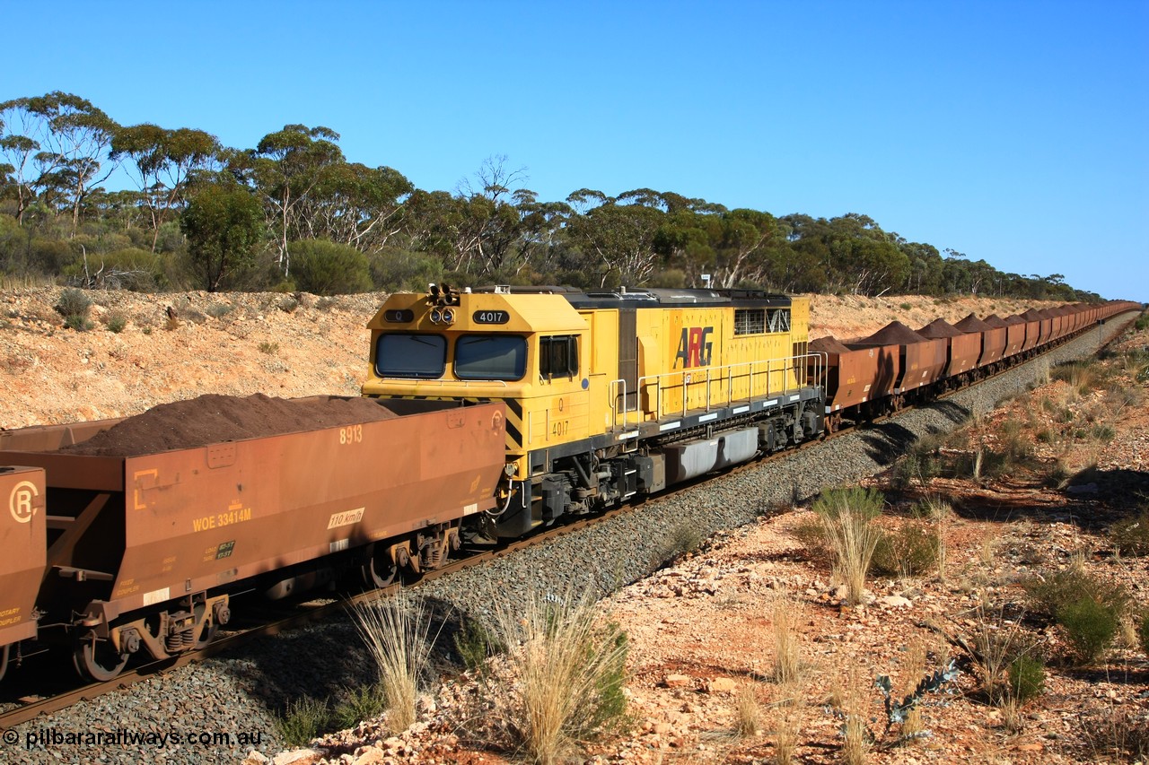 100602 8570
WOE type iron ore waggon WOE 33414 is one of a batch of one hundred and forty one built by United Group Rail WA between November 2005 and April 2006 with serial number 950142-119 and fleet number 8913 for Koolyanobbing iron ore operations, the 8 being a addition due to fleet size, and a build date of 04/2006 with a revised load of 82.5 tonnes with PORTMAN painted out, seen here with mid-train DPU locomotive Q 4017 and train out over the grade, west of Binduli, 2nd June 2010.
Keywords: WOE-type;WOE33414;United-Group-Rail-WA;950142-119;