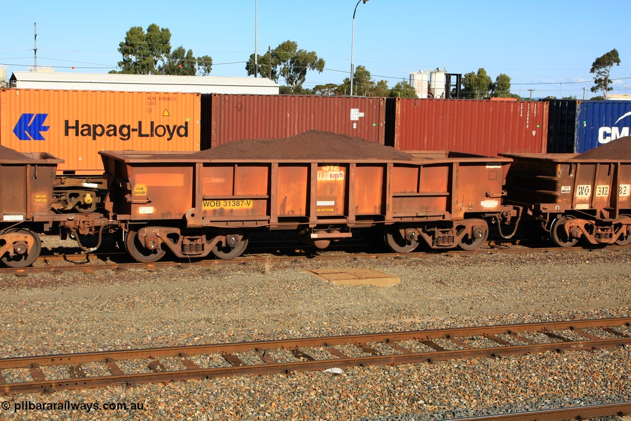 100602 8680
WOB type iron ore waggon WOB 31387 is one of a batch of twenty five built by Comeng WA between 1974 and 1975 and converted from Mt Newman high sided waggons by WAGR Midland Workshops with a capacity of 67 tons with fleet number 312 for Koolyanobbing iron ore operations. This waggon was also converted to a WSM type ballast hopper by re-fitting the cut down top section and having bottom discharge doors fitted, converted back to WOB in 1998, loaded with fines in West Kalgoorlie, 2nd June 2010.
Keywords: WOB-type;WOB31387;Comeng-WA;WSM-type;Mt-Newman-Mining;
