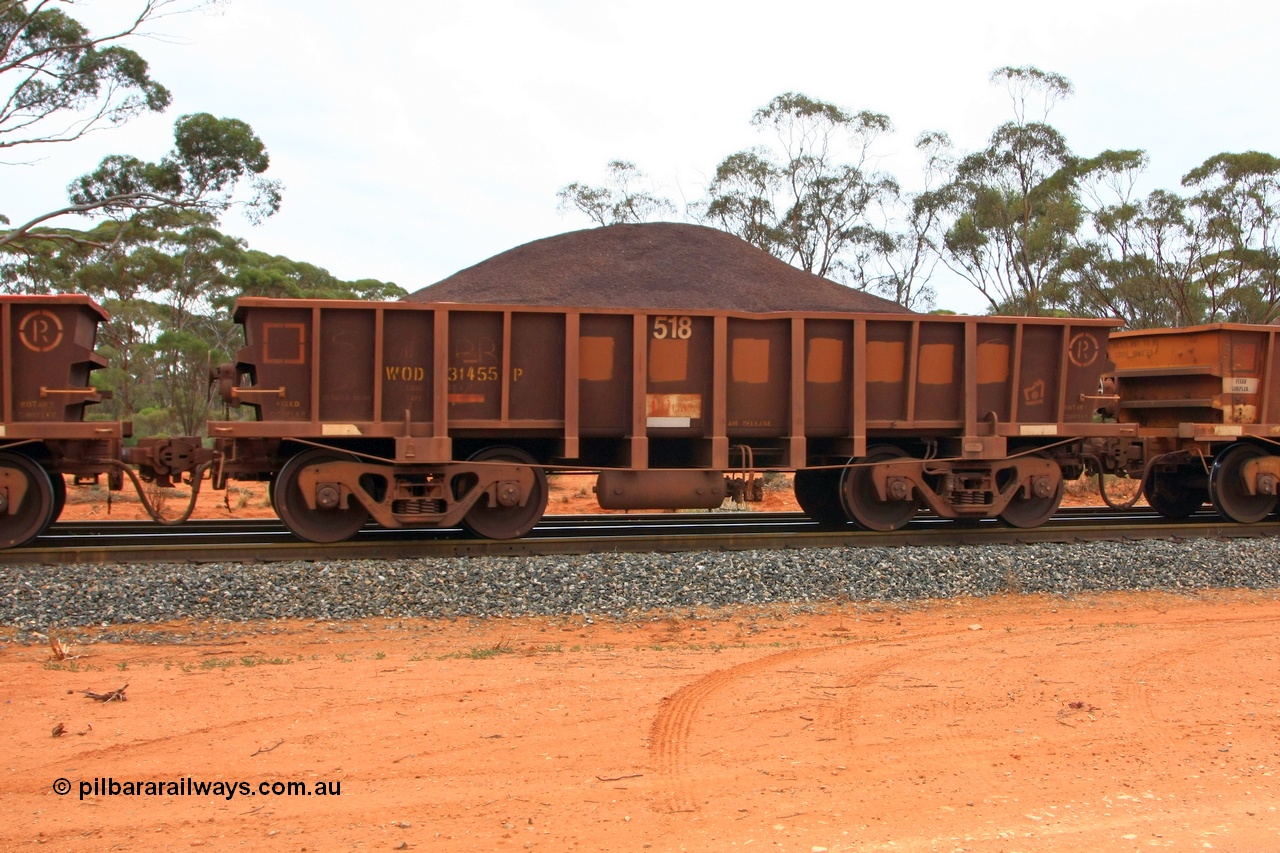 100605 9335
WOD type iron ore waggon WOD 31455 is one of a batch of sixty two built by Goninan WA between April and August 2000 with serial number 950086-027 and fleet number 518 for Koolyanobbing iron ore operations with a 75 ton capacity for Portman Mining to cart their Koolyanobbing iron ore to Esperance, now with PORTMAN painted out, Binduli Triangle, loaded with fines, 5th June 2010.
Keywords: WOD-type;WOD31455;Goninan-WA;950086-027;