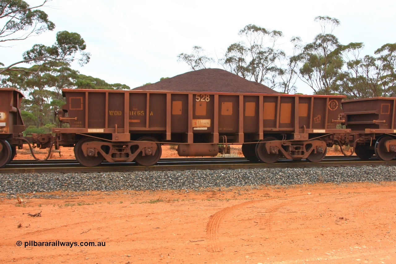 100605 9336
WOD type iron ore waggon WOD 31465 is one of a batch of sixty two built by Goninan WA between April and August 2000 with serial number 950086-037 and fleet number 528 for Koolyanobbing iron ore operations with a 75 ton capacity for Portman Mining to cart their Koolyanobbing iron ore to Esperance, now with PORTMAN painted out, Binduli Triangle, loaded with fines, 5th June 2010.
Keywords: WOD-type;WOD31465;Goninan-WA;950086-037;