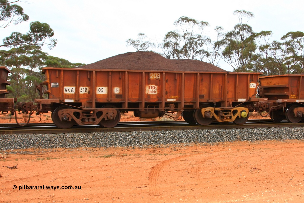 100605 9351
WOA type iron ore waggon WOA 31305 is one of a batch of thirty nine built by WAGR Midland Workshops between 1970 and 1971 with fleet number 203 for Koolyanobbing iron ore operations, with a 75 ton and 1018 ft³ capacity, Binduli Triangle, loaded with fines, 5th June 2010.
Keywords: WOA-type;WOA31305;WAGR-Midland-WS;