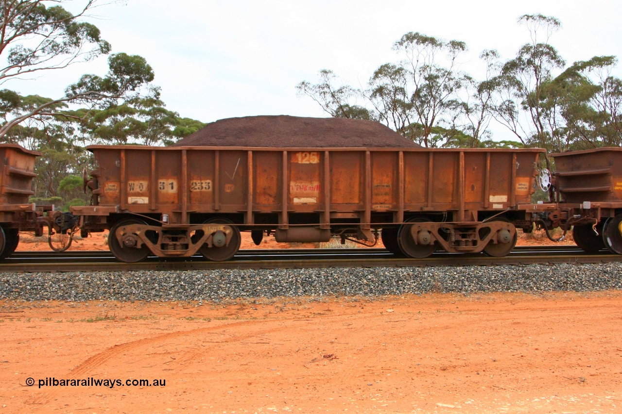 100605 9362
WO type iron ore waggon WO 31233 is one of a batch of eighty six built by WAGR Midland Workshops between 1967 and March 1968 with fleet number 125 for Koolyanobbing iron ore operations, with a 75 ton and 1018 ft³ capacity, Binduli Triangle, loaded with fines, 5th June 2010. This unit was converted to WOC for coal in 1986 till 1994 when it was re-classed back to WO.
Keywords: WO-type;WO31233;WAGR-Midland-WS;