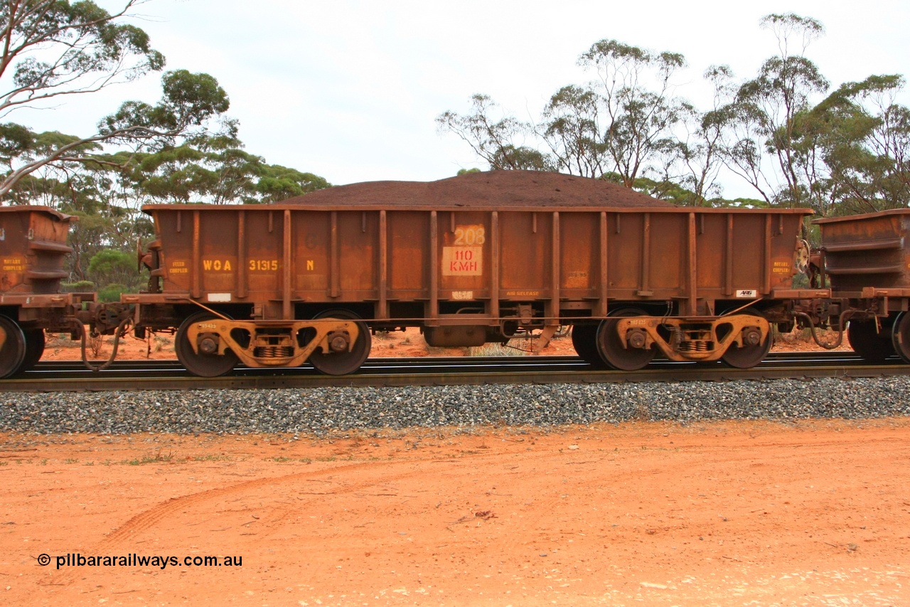 100605 9372
WOA type iron ore waggon WOA 31315 is one of a batch of thirty nine built by WAGR Midland Workshops between 1970 and 1971 with fleet number 208 for Koolyanobbing iron ore operations, with a 75 ton and 1018 ft³ capacity, Binduli Triangle, loaded with fines, 5th June 2010.
Keywords: WOA-type;WOA31315;WAGR-Midland-WS;