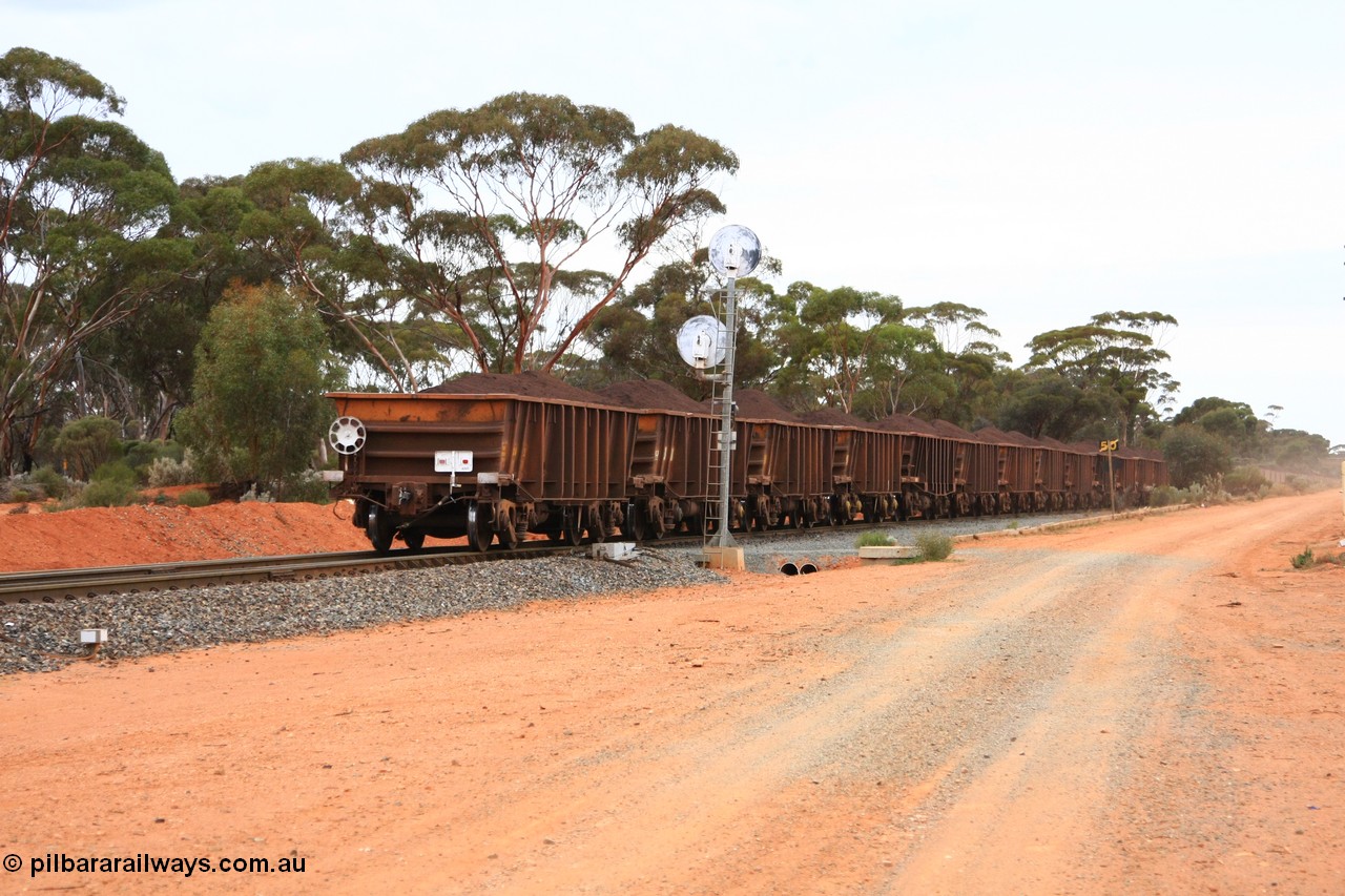 100605 9379
WOA type iron ore waggon WOA 31326 is one of a batch of thirty nine built by WAGR Midland Workshops between 1970 and 1971 with fleet number 211 for Koolyanobbing iron ore operations, with a 75 ton and 1018 ft³ capacity, trailing view with EoT device and loaded ore train departing Binduli Triangle, 5th June 2010.
Keywords: WOA-type;WOA31326;WAGR-Midland-WS;