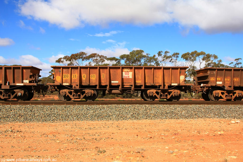 100729 01498
WO type iron ore waggon WO 31401 is leader of a batch of eleven replacement waggons built by WAGR Midland Workshops between 1970 and 1971 with fleet number 180 for Koolyanobbing iron ore operations, with a 75 ton and 1018 ft³ capacity. This unit was converted to WOC for coal in 1986 till 1994 when it was re-classed back to WO. On loaded train 7415 at Binduli Triangle, 29th July 2010.
Keywords: WO-type;WO31401;WAGR-Midland-WS;