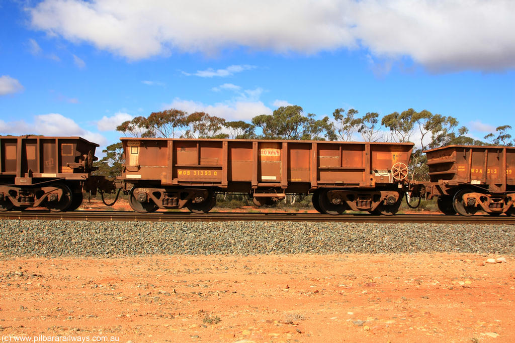 100729 01504
WOB type iron ore waggon WOB 31393 is one of a batch of twenty five built by Comeng WA between 1974 and 1975 and converted from Mt Newman high sided waggons by WAGR Midland Workshops with a capacity of 67 tons with fleet number 318 for Koolyanobbing iron ore operations. This waggon was also converted to a WSM type ballast hopper by re-fitting the cut down top section and having bottom discharge doors fitted, converted back to WOB in 1998, returning empty to Koolyanobbing at Binduli, 29th July 2010.
Keywords: WOB-type;WOB31393;Comeng-WA;WSM-type;Mt-Newman-Mining;