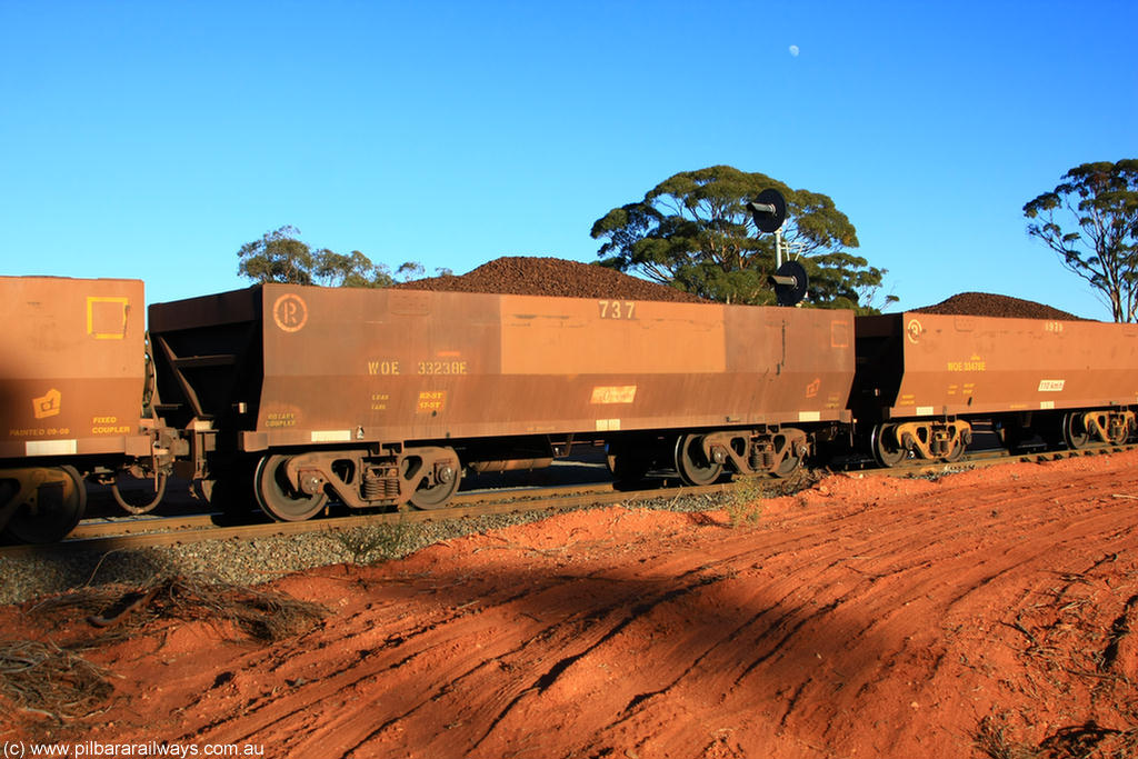 100731 02290
WOE type iron ore waggon WOE 33238 is one of a batch of twenty seven built by Goninan WA between September and October 2002 with serial number 950103-005 and fleet number 737 for Koolyanobbing iron ore operations, on loaded train 6413 at Binduli Triangle, 31st July 2010.
Keywords: WOE-type;WOE33238;Goninan-WA;950103-005;
