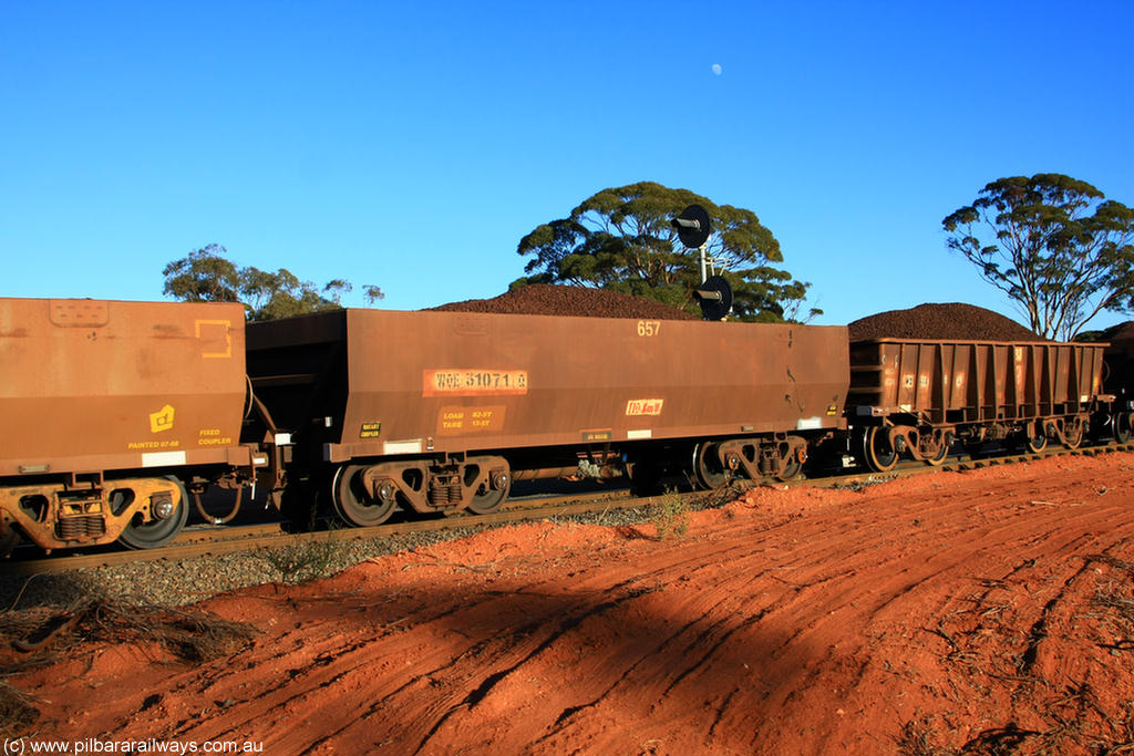100731 02299
WOE type iron ore waggon WOE 31071 is one of a batch of one hundred and thirty built by Goninan WA between March and August 2001 with serial number 950092-061 and fleet number 657 for Koolyanobbing iron ore operations, on loaded train 6413 at Binduli Triangle, 31st July 2010.
Keywords: WOE-type;WOE31071;Goninan-WA;950092-061;
