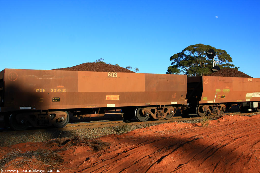 100731 02301
WOE type iron ore waggon WOE 30253 is one of a batch of one hundred and thirty built by Goninan WA between March and August 2001 with serial number 950092-003 and fleet number 603 for Koolyanobbing iron ore operations of Portman Mining, on loaded train 6413 at Binduli Triangle, 31st July 2010.
Keywords: WOE-type;WOE30253;Goninan-WA;950092-003;