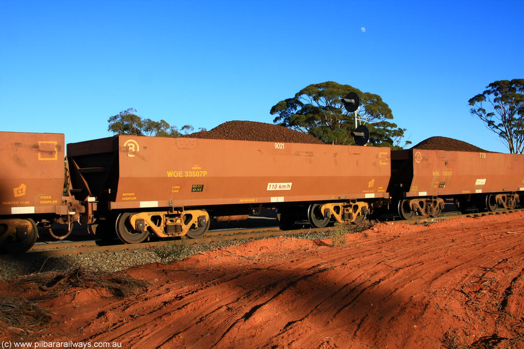 100731 02307
WOE type iron ore waggon WOE 33507 is one of a batch of one hundred and twenty eight built by United Group Rail WA between August 2008 and March 2009 with serial number 950211-047 and fleet number 9021 for Koolyanobbing iron ore operations, on loaded train 6413 at Binduli Triangle, 31st July 2010.
Keywords: WOE-type;WOE33507;United-Group-Rail-WA;950211-047;