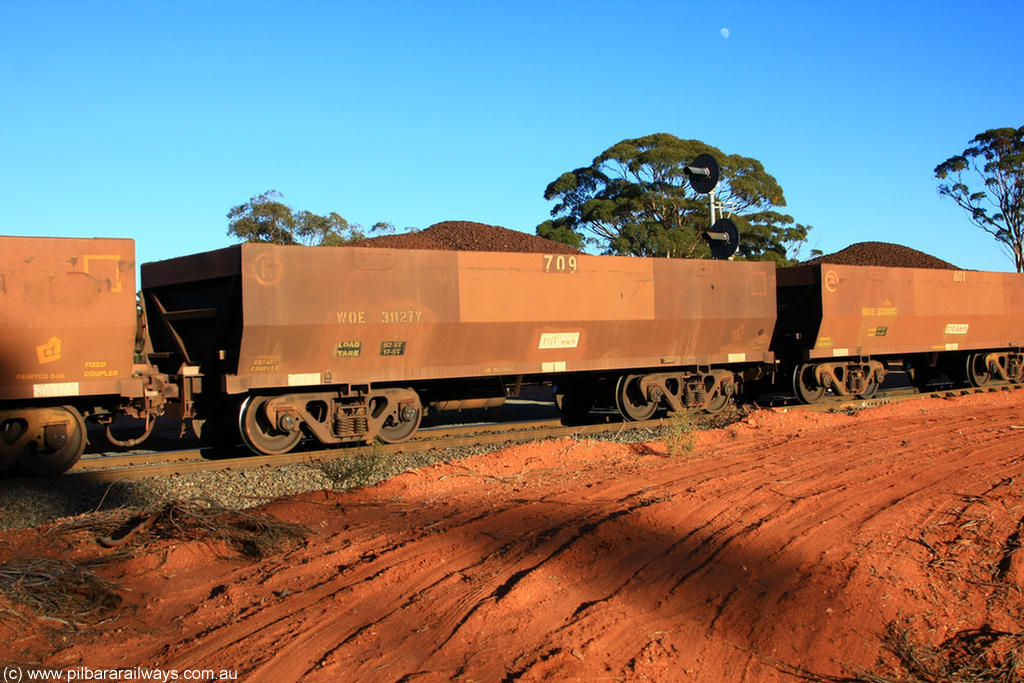 100731 02325
WOE type iron ore waggon WOE 31127 is one of a batch of one hundred and thirty built by Goninan WA between March and August 2001 with serial number 950092-117 and fleet number 709 for Koolyanobbing iron ore operations, on loaded train 6413 at Binduli Triangle, 31st July 2010.
Keywords: WOE-type;WOE31127;Goninan-WA;950092-117;