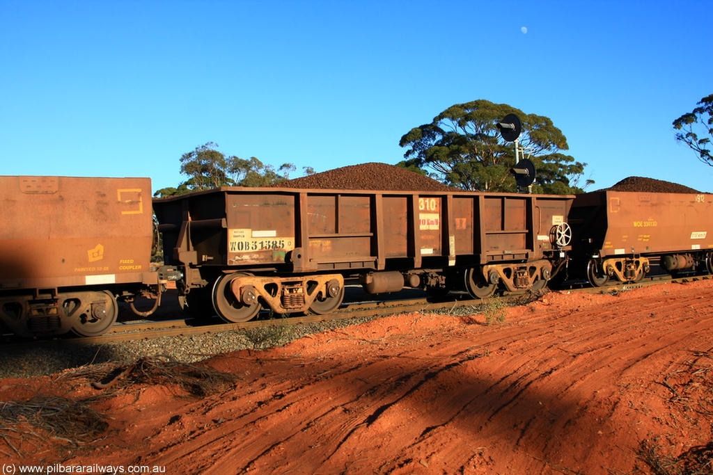 100731 02336
WOB type iron ore waggon WOB 31385 is one of a batch of twenty five built by Comeng WA between 1974 and 1975 and converted from Mt Newman high sided waggons by WAGR Midland Workshops with a capacity of 67 tons with fleet number 310 for Koolyanobbing iron ore operations, on loaded train 6413 at Binduli Triangle, 31st July 2010.
Keywords: WOB-type;WOB31385;Comeng-WA;Mt-Newman-Mining;