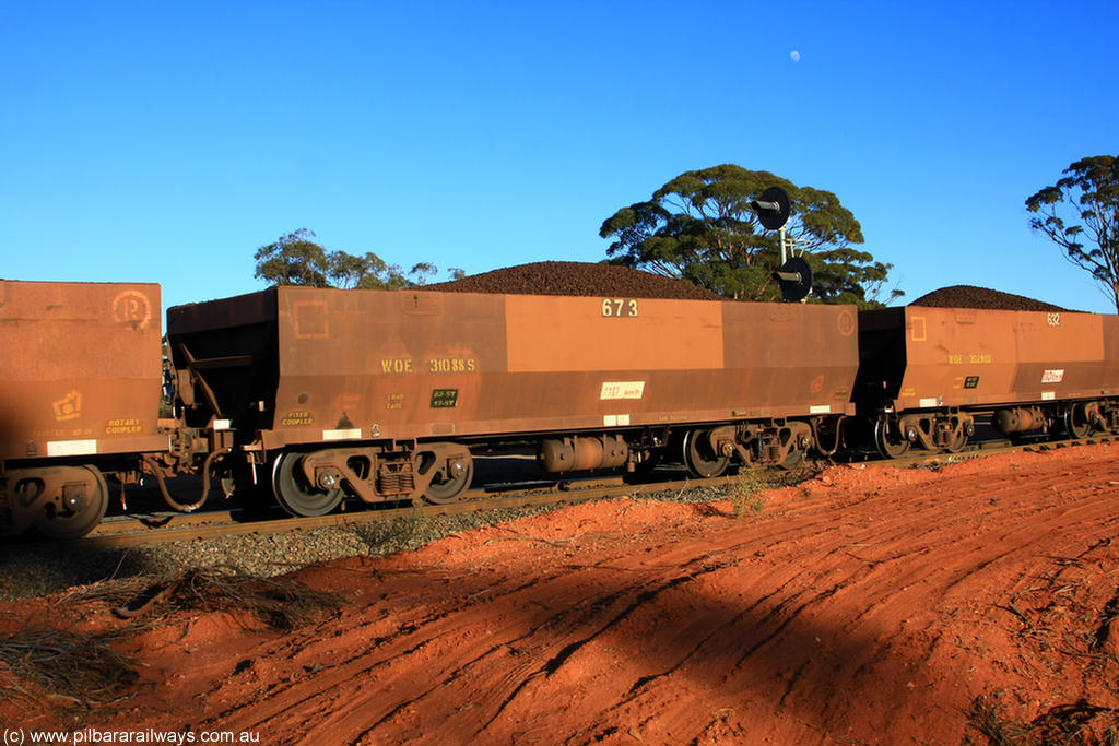 100731 02339
WOE type iron ore waggon WOE 31088 is one of a batch of one hundred and thirty built by Goninan WA between March and August 2001 with serial number 950092-078 and fleet number 673 for Koolyanobbing iron ore operations, on loaded train 6413 at Binduli Triangle, 31st July 2010.
Keywords: WOE-type;WOE31088;Goninan-WA;950092-078;