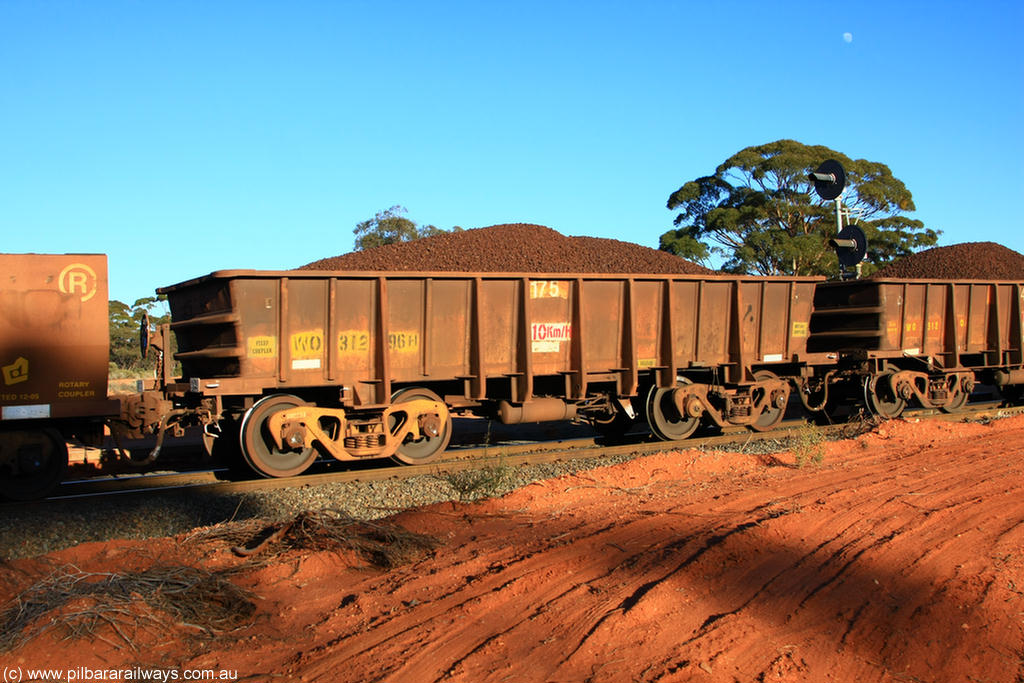 100731 02342
WO type iron ore waggon WO 31296 is one of a batch of fifteen built by WAGR Midland Workshops between July and October 1968 with fleet number 175 for Koolyanobbing iron ore operations, with a 75 ton and 1018 ft³ capacity, on loaded train 6413 at Binduli Triangle, 31st July 2010. This unit was converted to WOC for coal in 1986 till 1994 when it was re-classed back to WO.
Keywords: WO-type;WO31296;WAGR-Midland-WS;