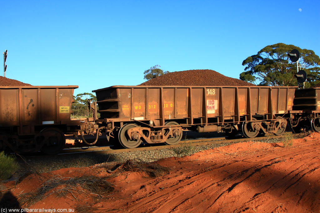 100731 02343
WO type iron ore waggon WO 31262 is one of a batch of eighty six built by WAGR Midland Workshops between 1967 and March 1968 with fleet number 148 for Koolyanobbing iron ore operations, with a 75 ton and 1018 ft³ capacity, on loaded train 6413 at Binduli Triangle, 31st July 2010. This unit was converted to WOC for coal in 1986 till 1994 when it was re-classed back to WO.
Keywords: WO-type;WO31262;WAGR-Midland-WS;