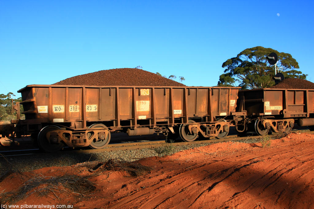 100731 02345
WO type iron ore waggon WO 31283 is one of a batch of eighty six built by WAGR Midland Workshops between 1967 and March 1968 with fleet number 163 for Koolyanobbing iron ore operations, with a 75 ton and 1018 ft³ capacity, on loaded train 6413 at Binduli Triangle, 31st July 2010. This unit was converted to WOS superphosphate in the late 1980s till 1994 when it was re-classed back to WO.
Keywords: WO-type;WO31283;31283;WAGR-Midland-WS;WOS-type;