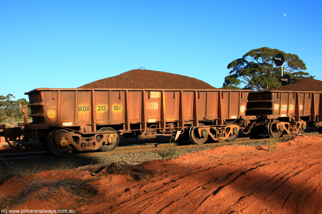 100731 02351
WOA type iron ore waggon WOA 31310 is one of a batch of thirty nine built by WAGR Midland Workshops between 1970 and 1971 with fleet number 206 for Koolyanobbing iron ore operations, with a 75 ton and 1018 ft³ capacity, on loaded train 6413 at Binduli Triangle, 31st July 2010.
Keywords: WOA-type;WOA31310;WAGR-Midland-WS;